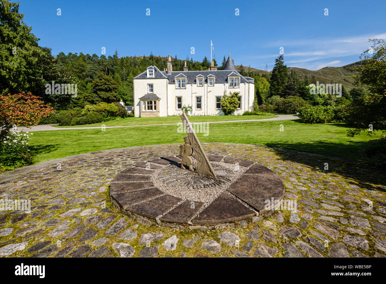Attadale House and Gardens with sundial in foreground.by  Loch Carron, near Strathcarron, NW Highlands of Scotland Stock Photo