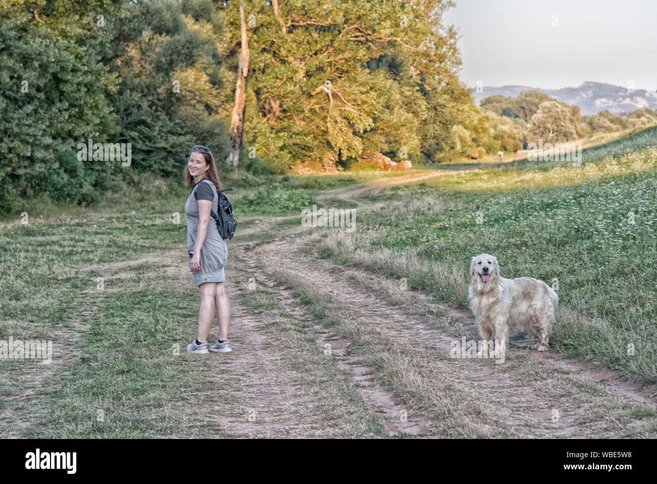 Woman and dog walking outdoor Stock Photo