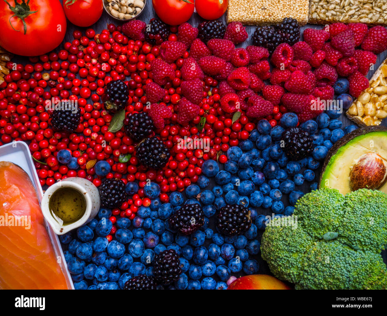 Clean eating concept over wooden background, top view. Variety of ...