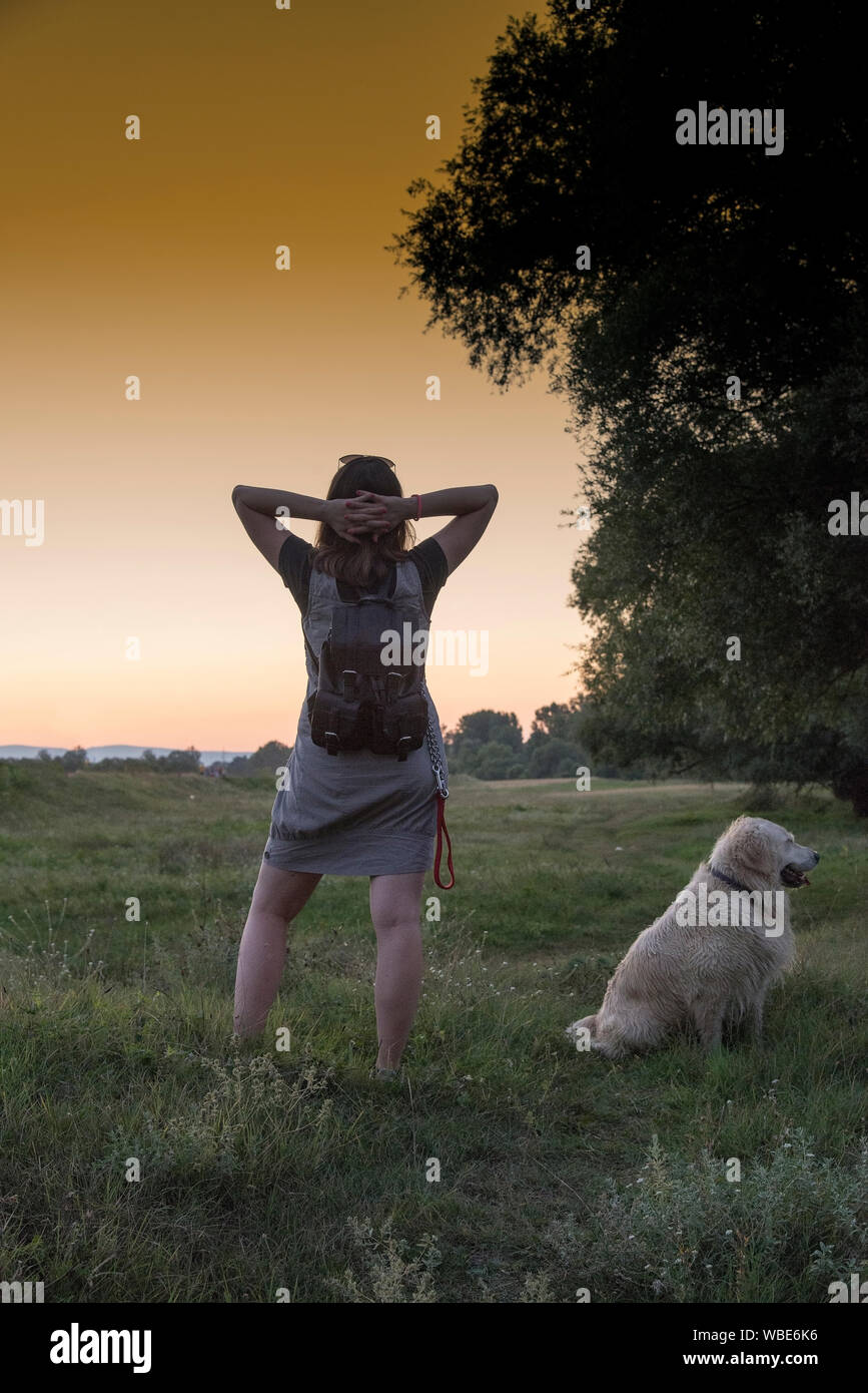 Woman and dog walking outdoor Stock Photo