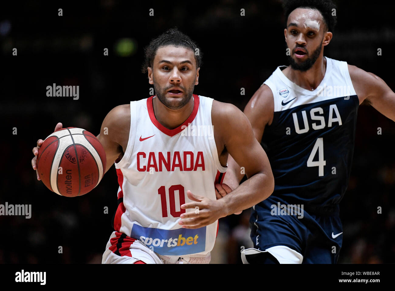 Sydney, Australia. 26th Aug, 2019. International Basketball, United Sates  of America Basketball versus Canada Basketball; Kaza Kajami-Keane of Canada  is followed closely by Derrick White of USA - Editorial Use Only. Credit: