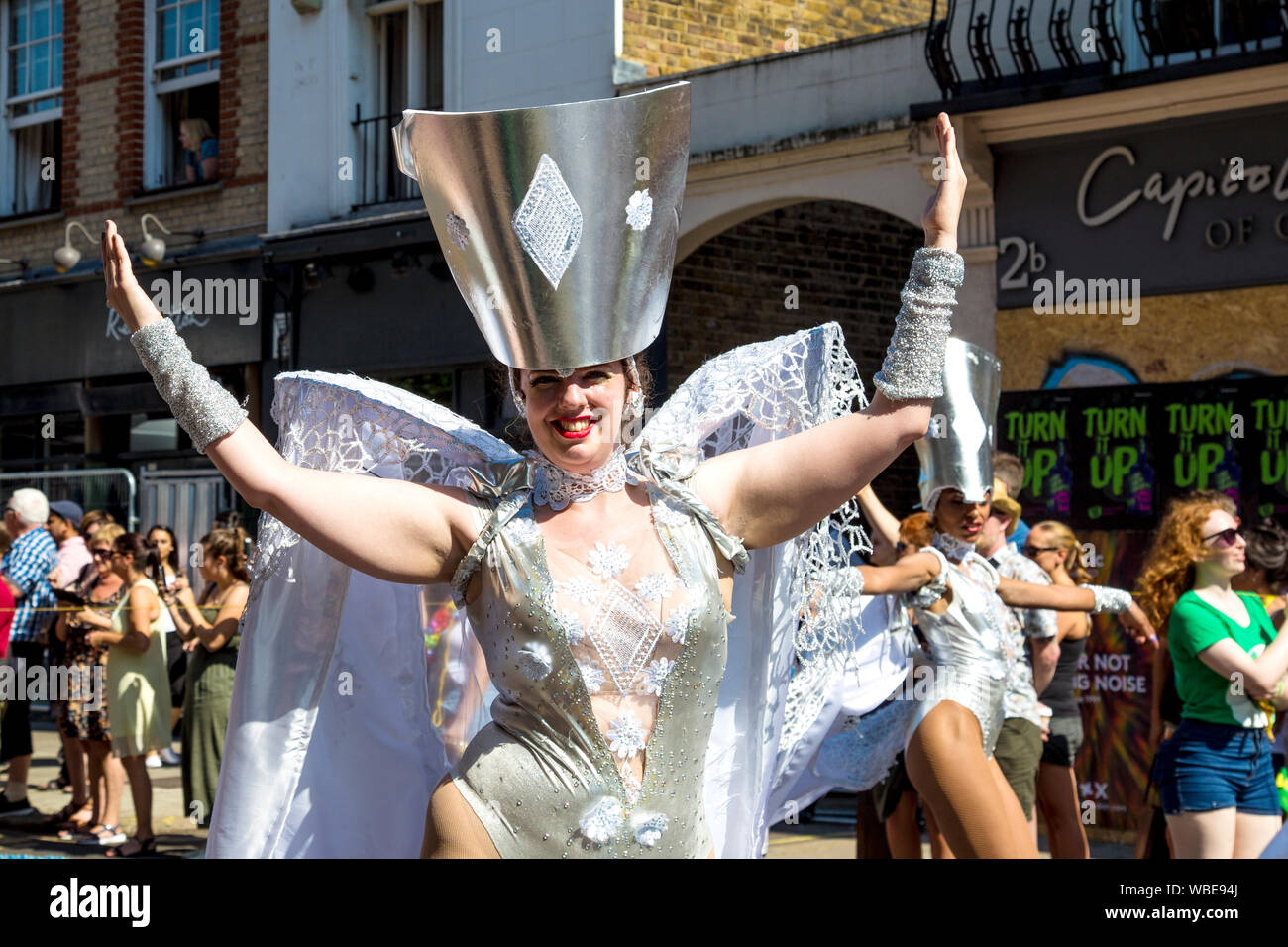 26 August 2019 - Women in a silver costume with headdress at Notting Hill Carnival on a hot Bank Holiday Monday, London, UK Stock Photo