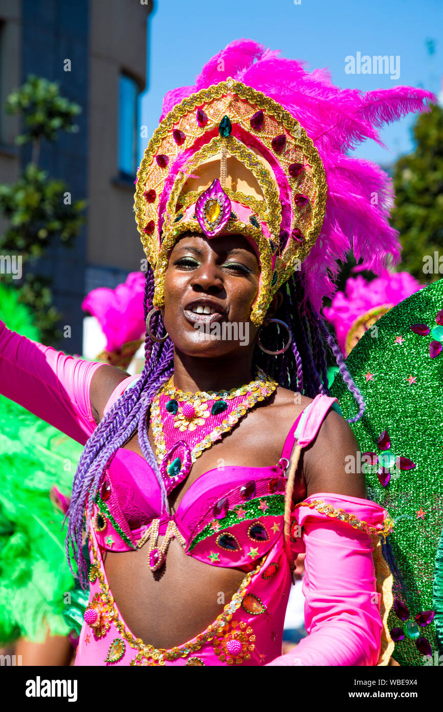 26 August 2019 - samba dancer wearing a headdress at the Notting Hill Carnival on a hot Bank Holiday Monday, London, UK Stock Photo