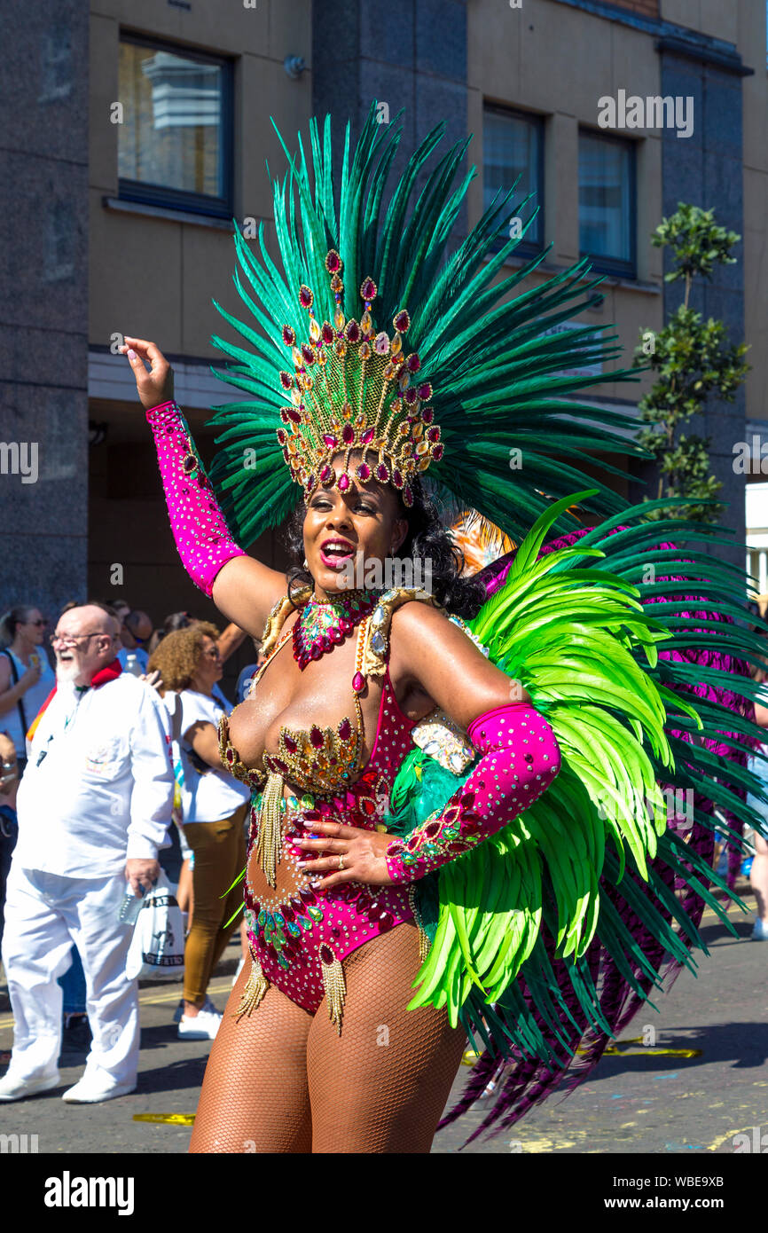 26 August 2019 - samba dancer wearing an ornate bodysuit and feather headdress at Notting Hill Carnival on a hot Bank Holiday Monday, London, UK Stock Photo