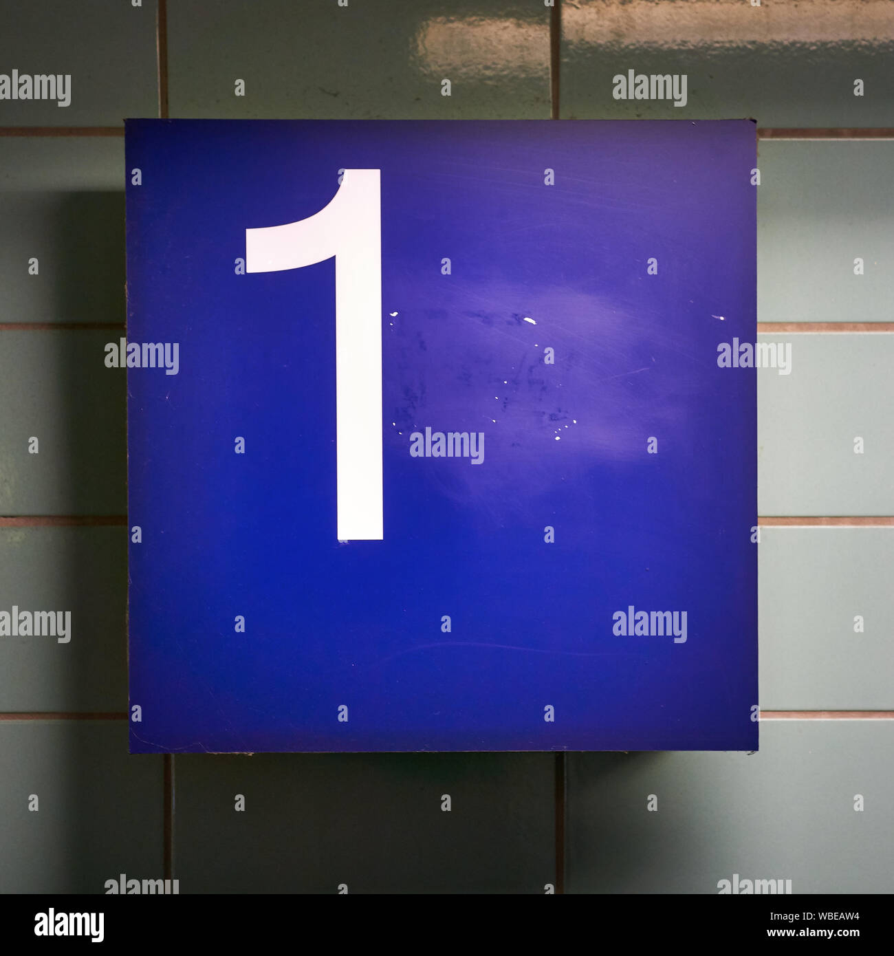Number 1 in white on a blue background Stock Photo - Alamy