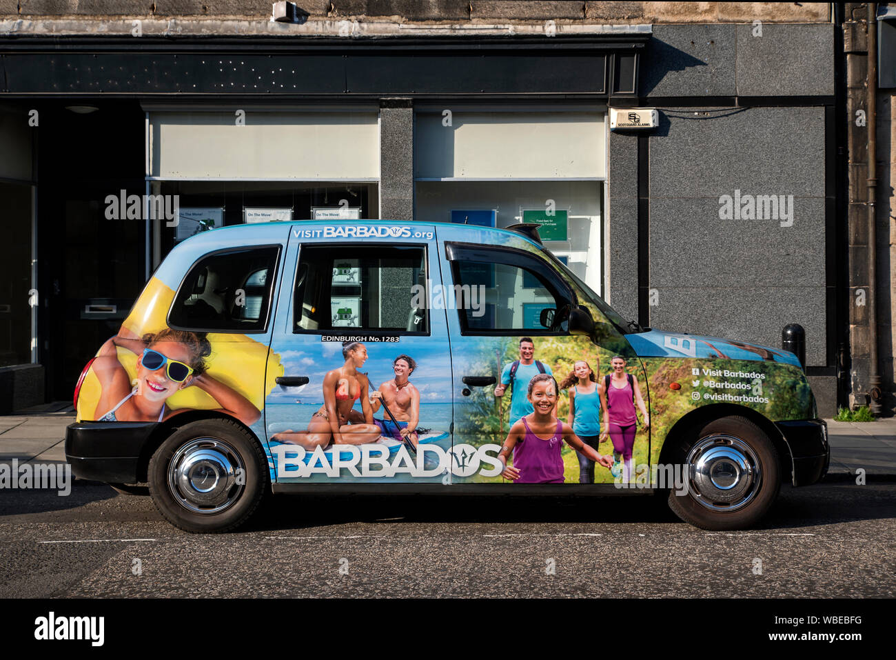 An Edinburgh taxi advertising holidays in Barbados Stock Photo Alamy