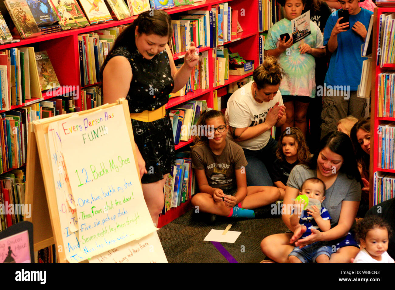 Drag Queens at a book reading event with children and families having