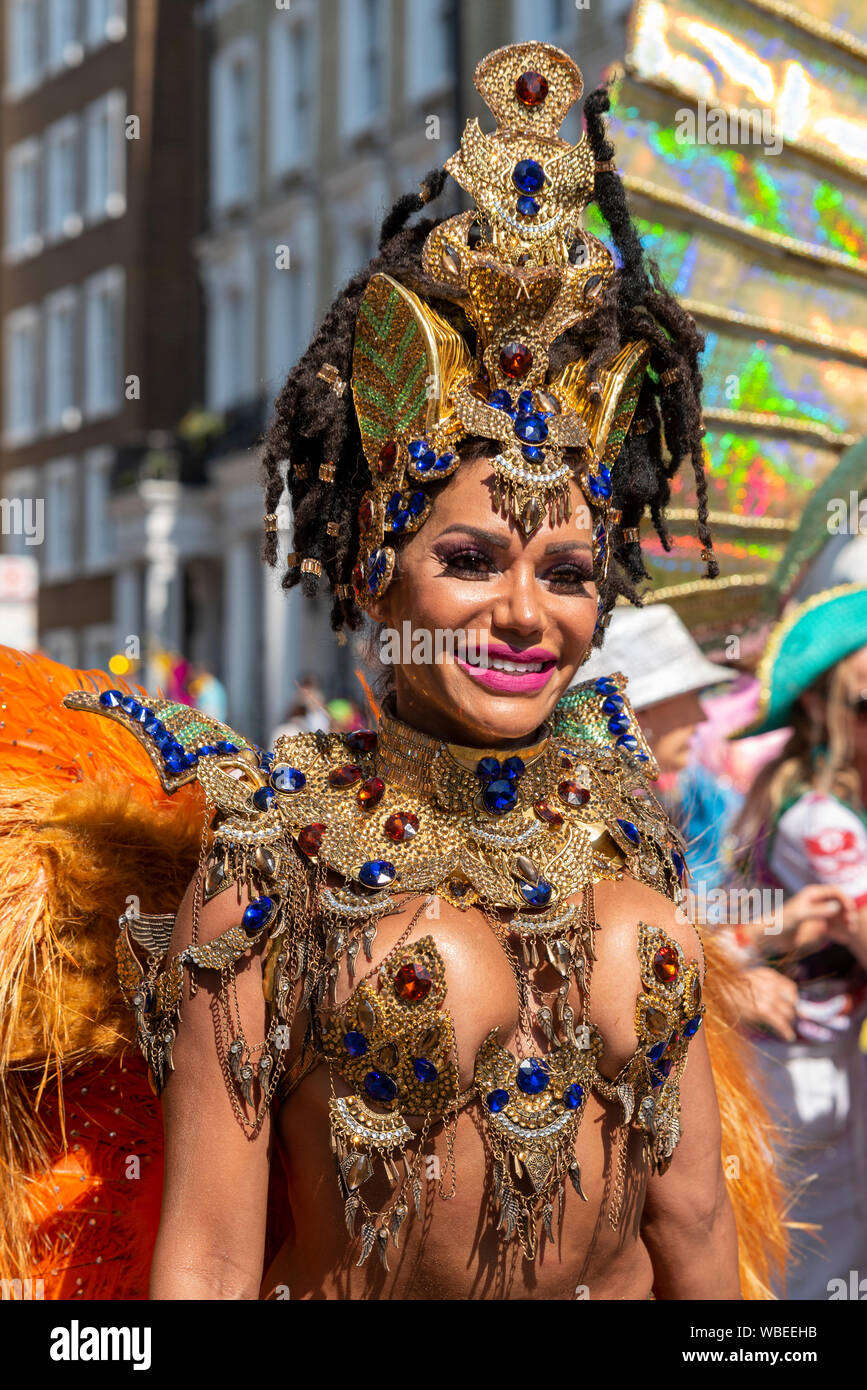 Female in colourful elaborate Jamaican costume at the Notting Hill Carnival  Final Parade on a hot Bank Holiday Monday. Jewelled nipples Stock Photo -  Alamy