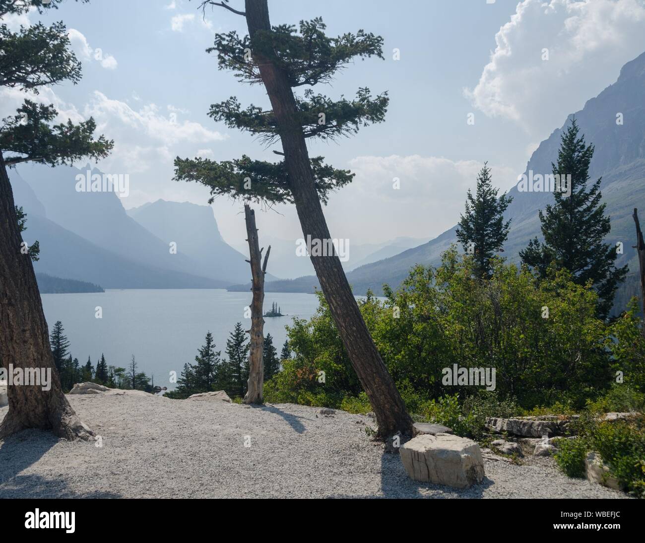 A view of Wild Goose Island while smoke hangs in the air in Glacier ...