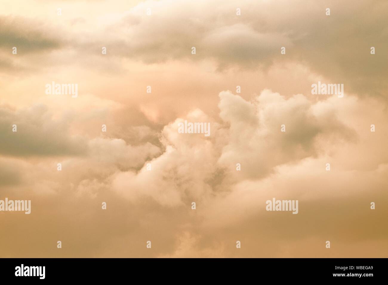 Pastel coloured colored evening cumulus sky clouds. Pink, blue and grey gray colors colours Stock Photo