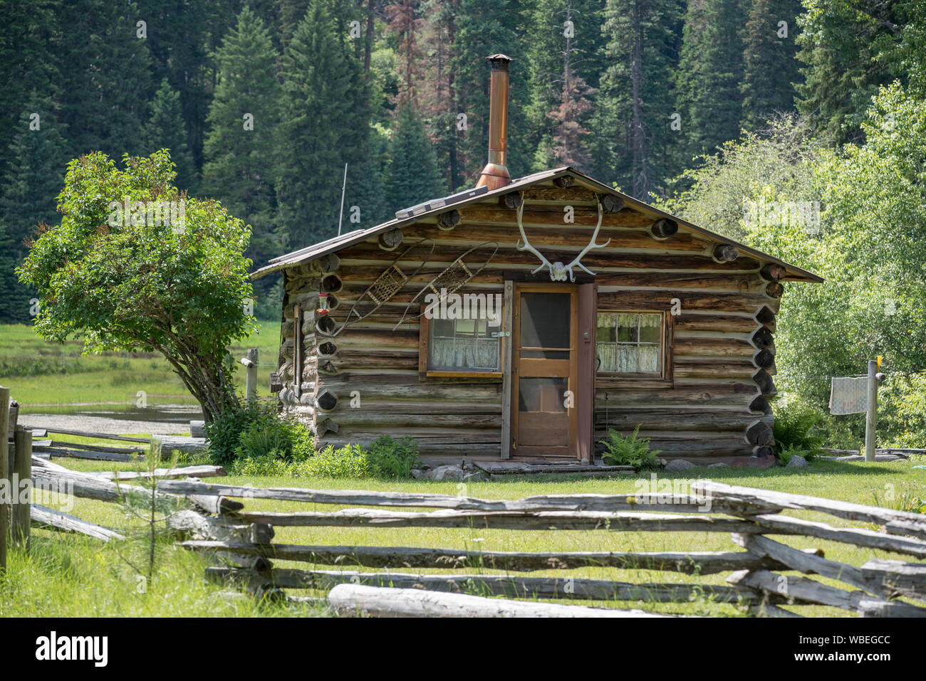Old log cabin at Reds Horse Ranch in Oregon's Wallowa Mountains Stock
