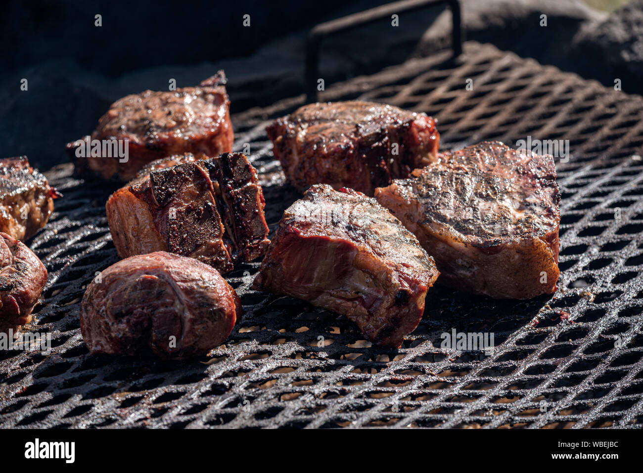 Meat cooking over a wood fire at the Minam River Lodge in Oregon's Wallowa Mountains. Stock Photo