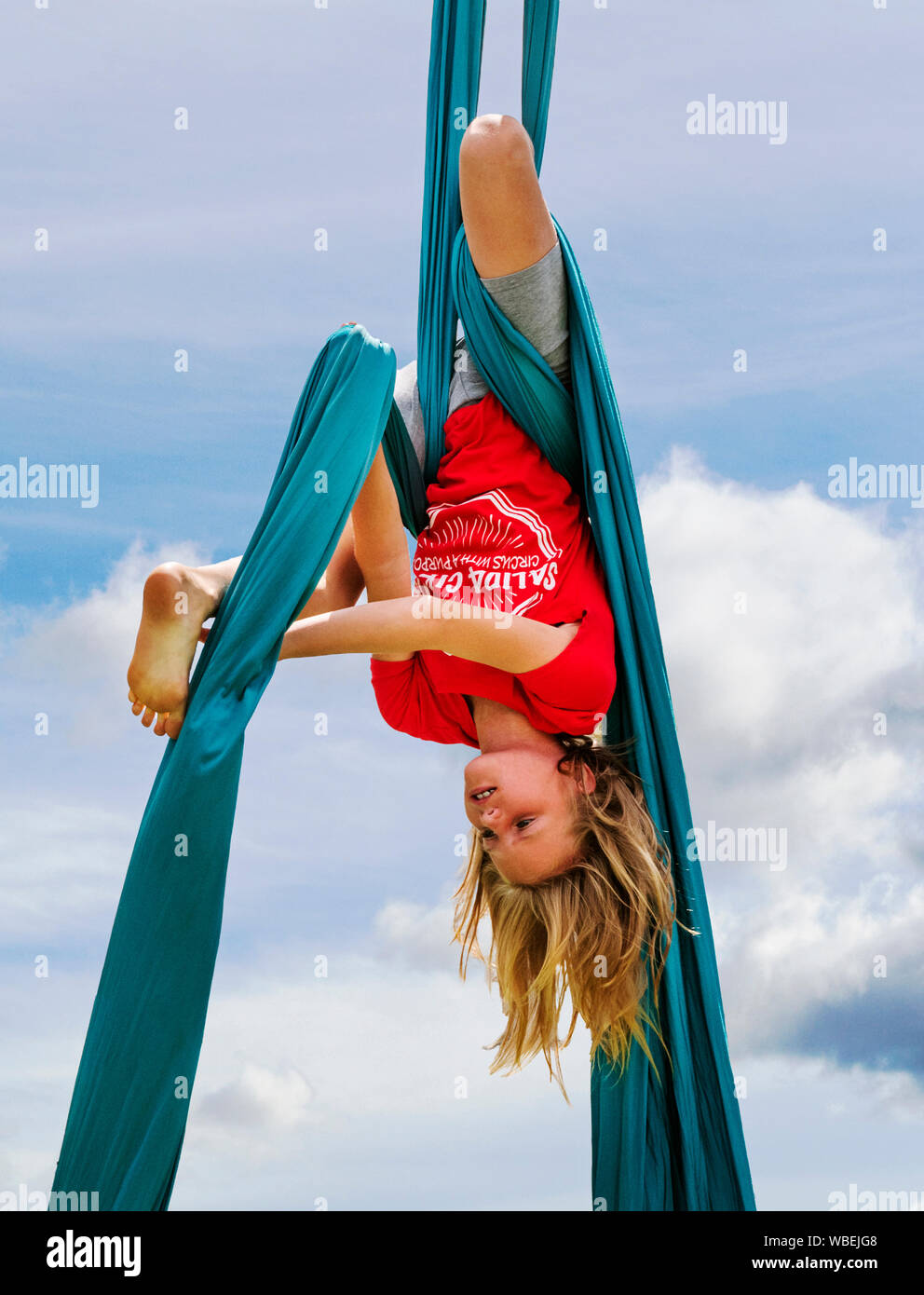 Young girl performing on aerial circus silks; Salida Circus summer camp finale; Salida; Colorado; USA Stock Photo