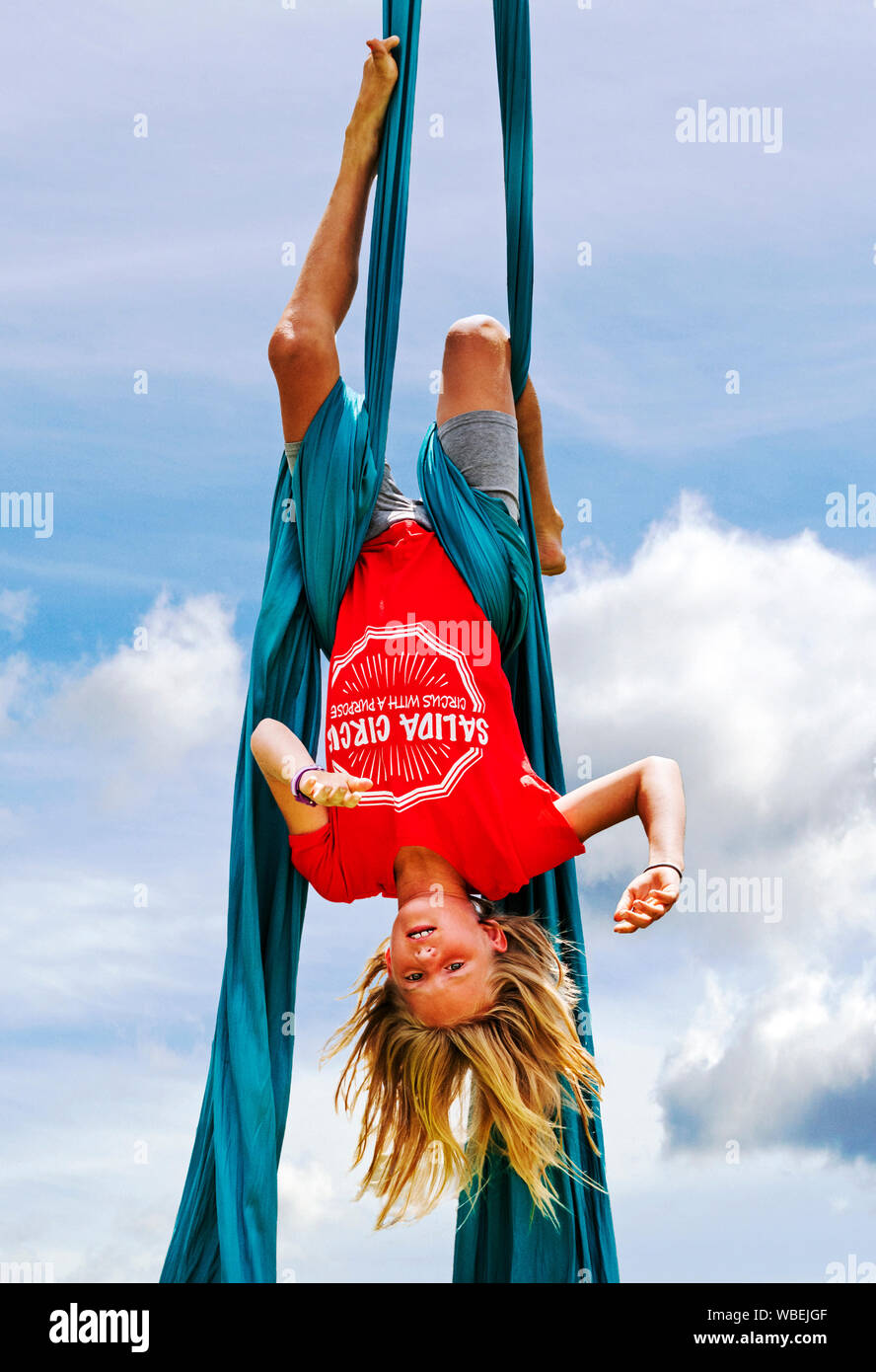 Young girl performing on aerial circus silks; Salida Circus summer camp finale; Salida; Colorado; USA Stock Photo