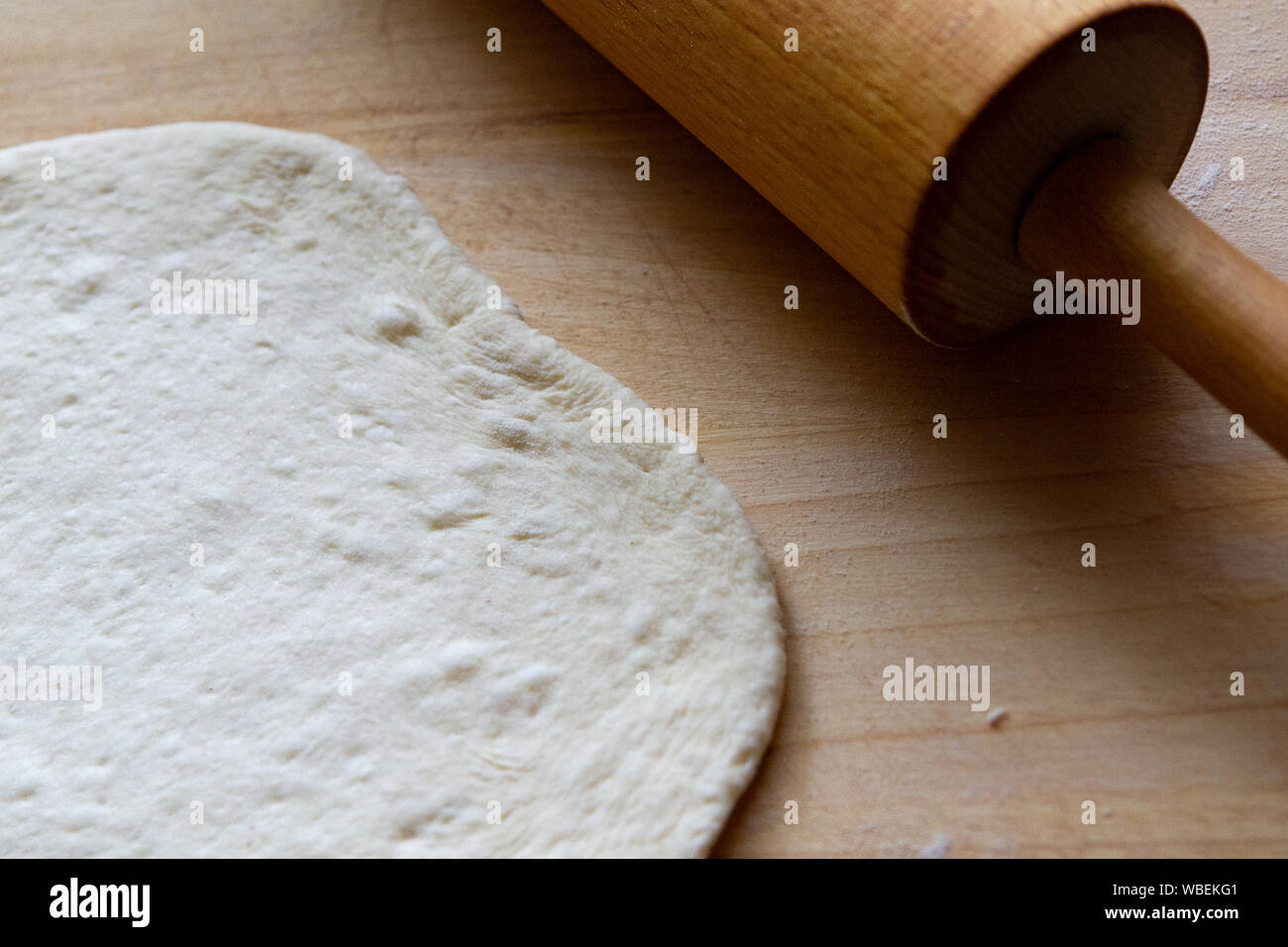 preparation of a dough for baking on a chopping board - preparing Slovakian steamed buns Stock Photo