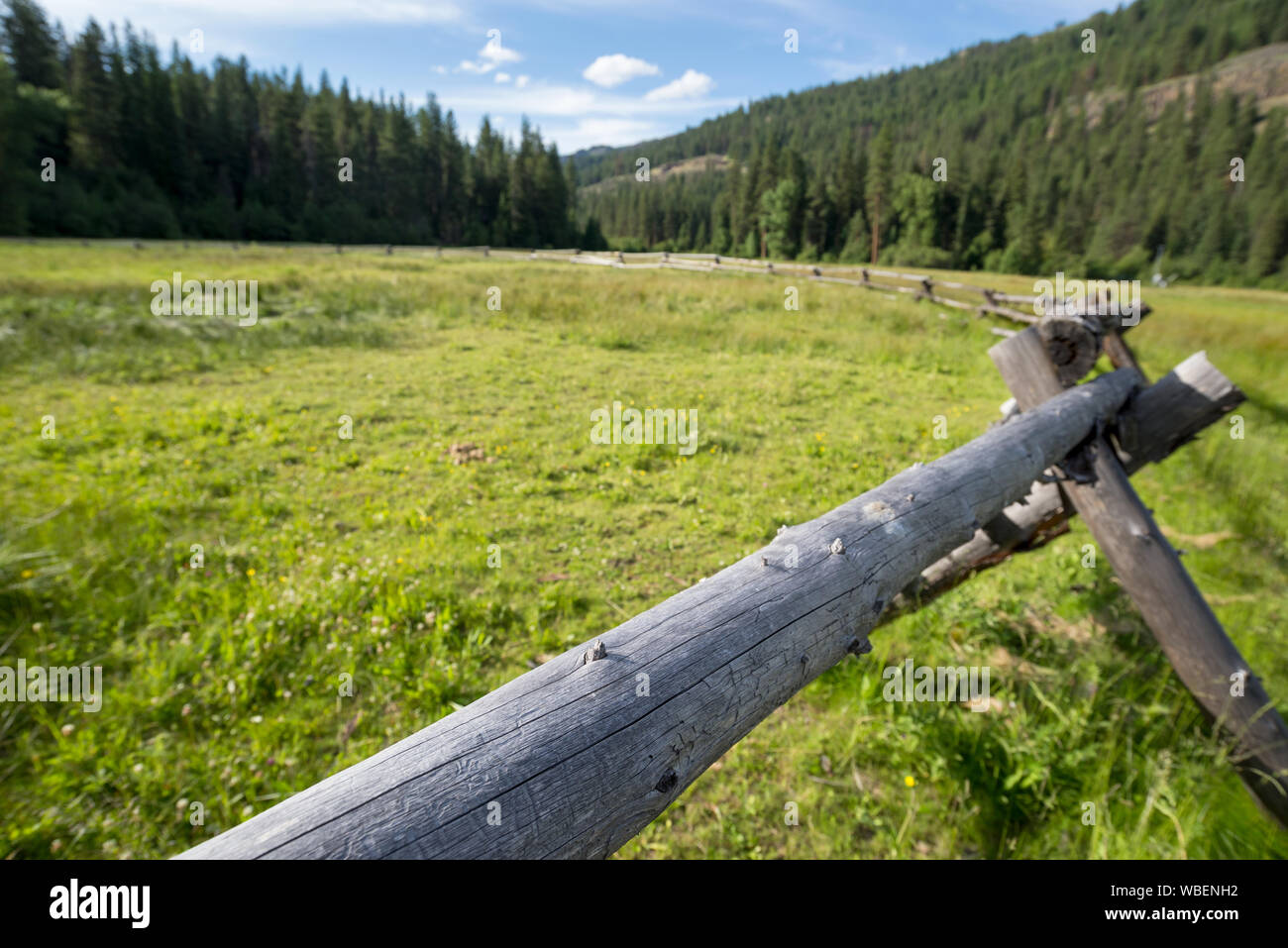 Log fence at the Minam River Lodge in Oregon's Wallowa Mountains. Stock Photo