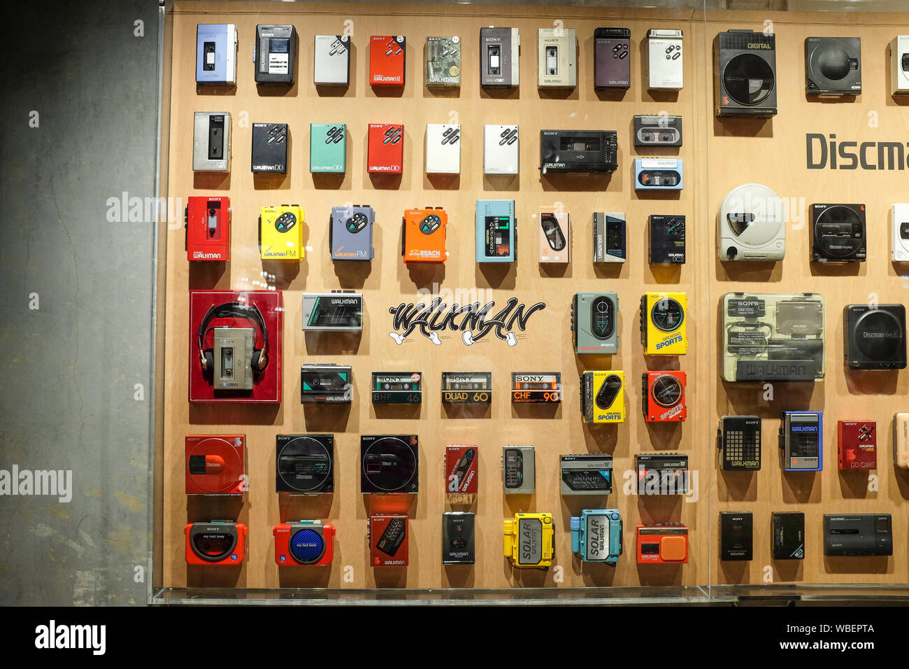 A display of Sony portable audio devices such as the Walkman and Discman. Displayed on the 'Walkman Wall' at an exhibition in Tokyo, Japan in 2019. Stock Photo