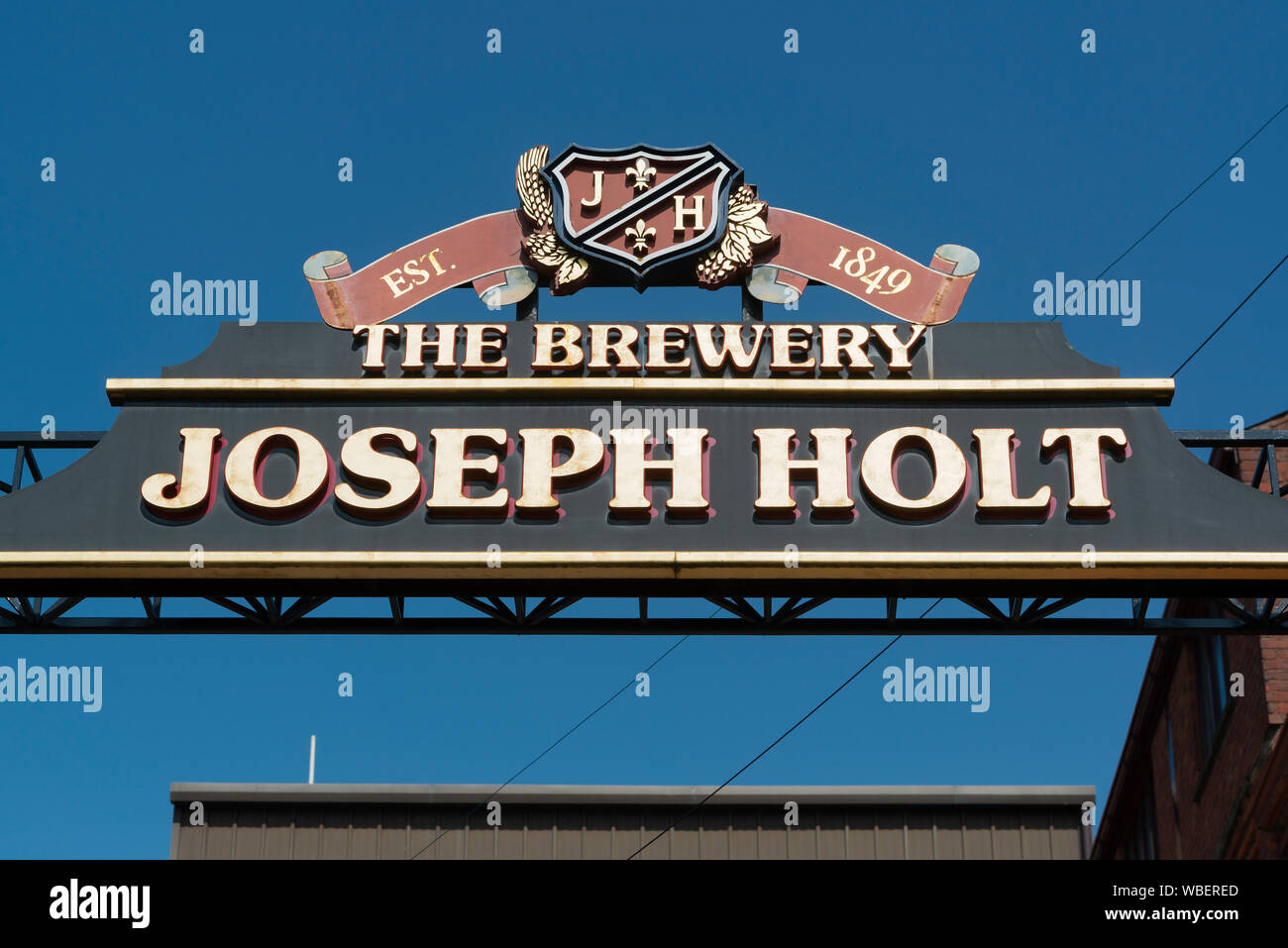 Signage for Joseph Holt brewery located on Empire Street in the Strangeways area of Manchester, UK. Stock Photo
