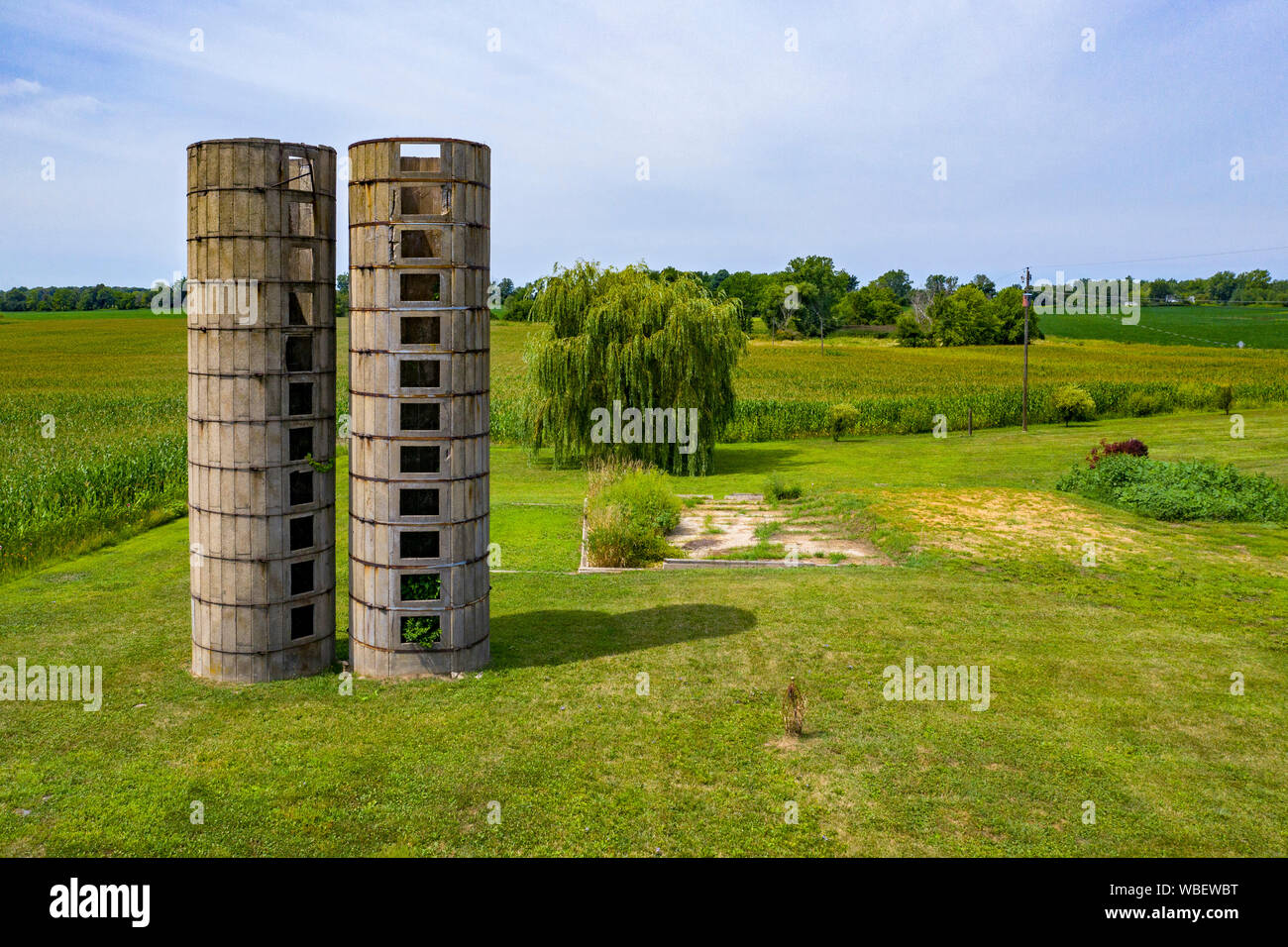 Three Oaks, Michigan - The remains of two old concrete silos on a Michigan farm. Stock Photo
