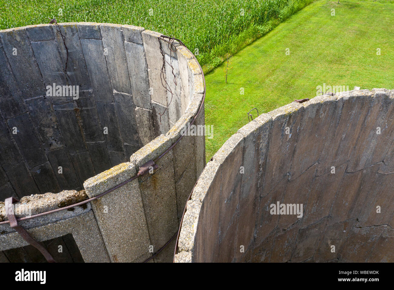 Three Oaks, Michigan - The remains of two old concrete silos on a Michigan farm. Stock Photo