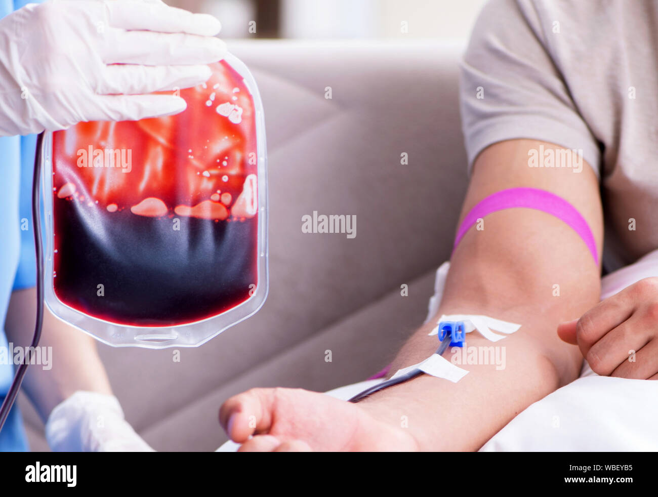 The patient getting blood transfusion in hospital clinic Stock Photo