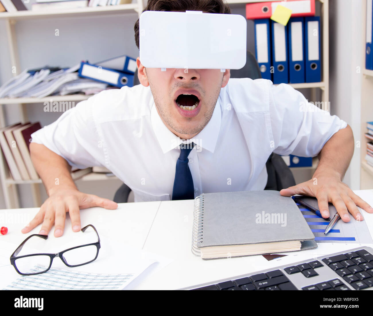 The employee watching movie on vr virtual reality glasses Stock Photo ...