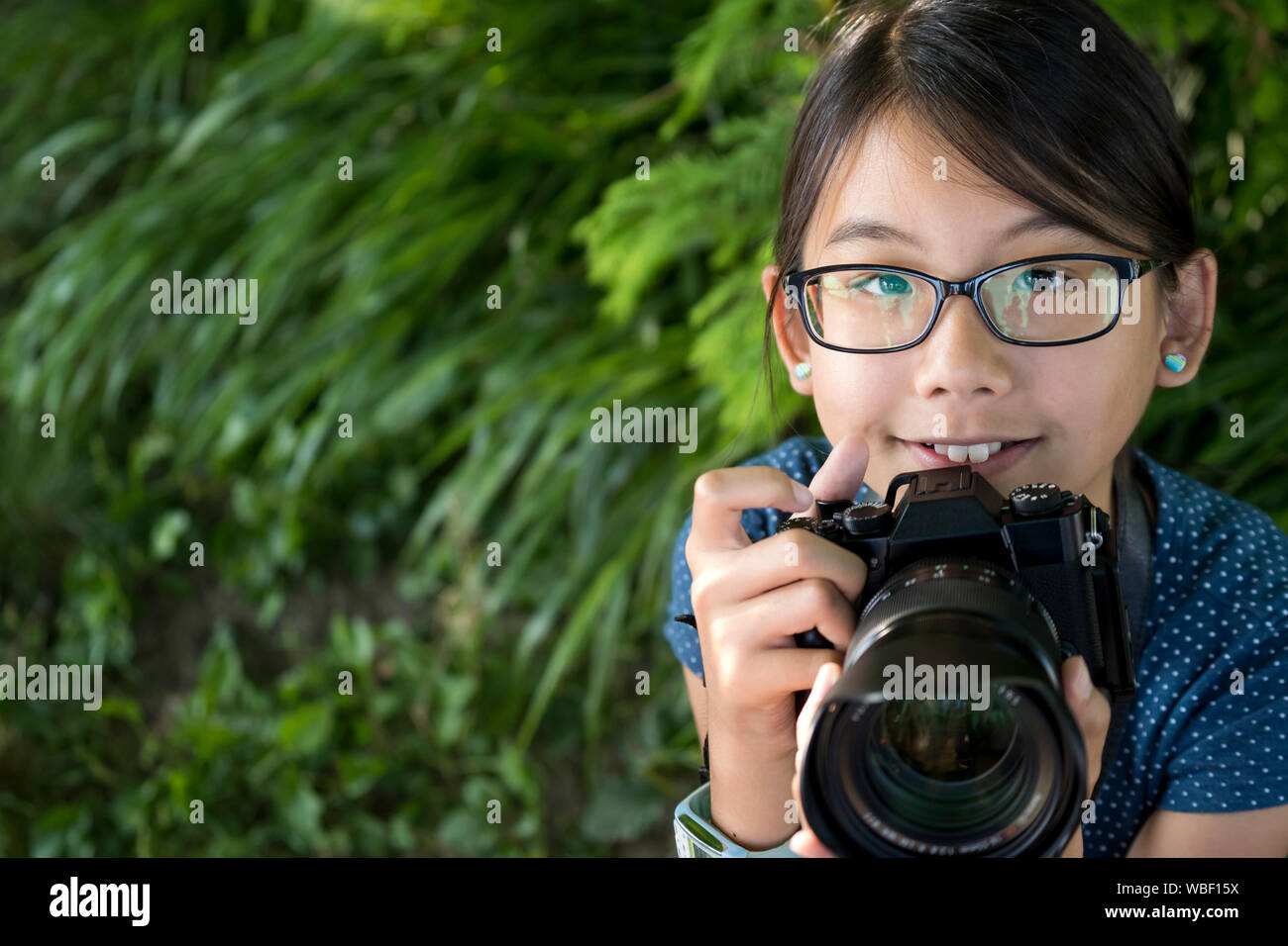 Girl photographer with digital camera Stock Photo Alamy