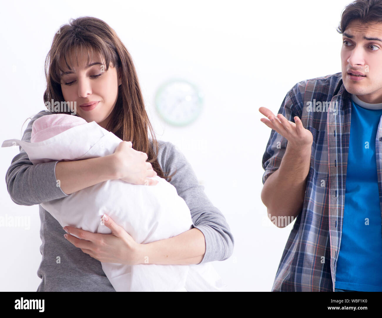 The young dad cannot stand baby crying Stock Photo - Alamy