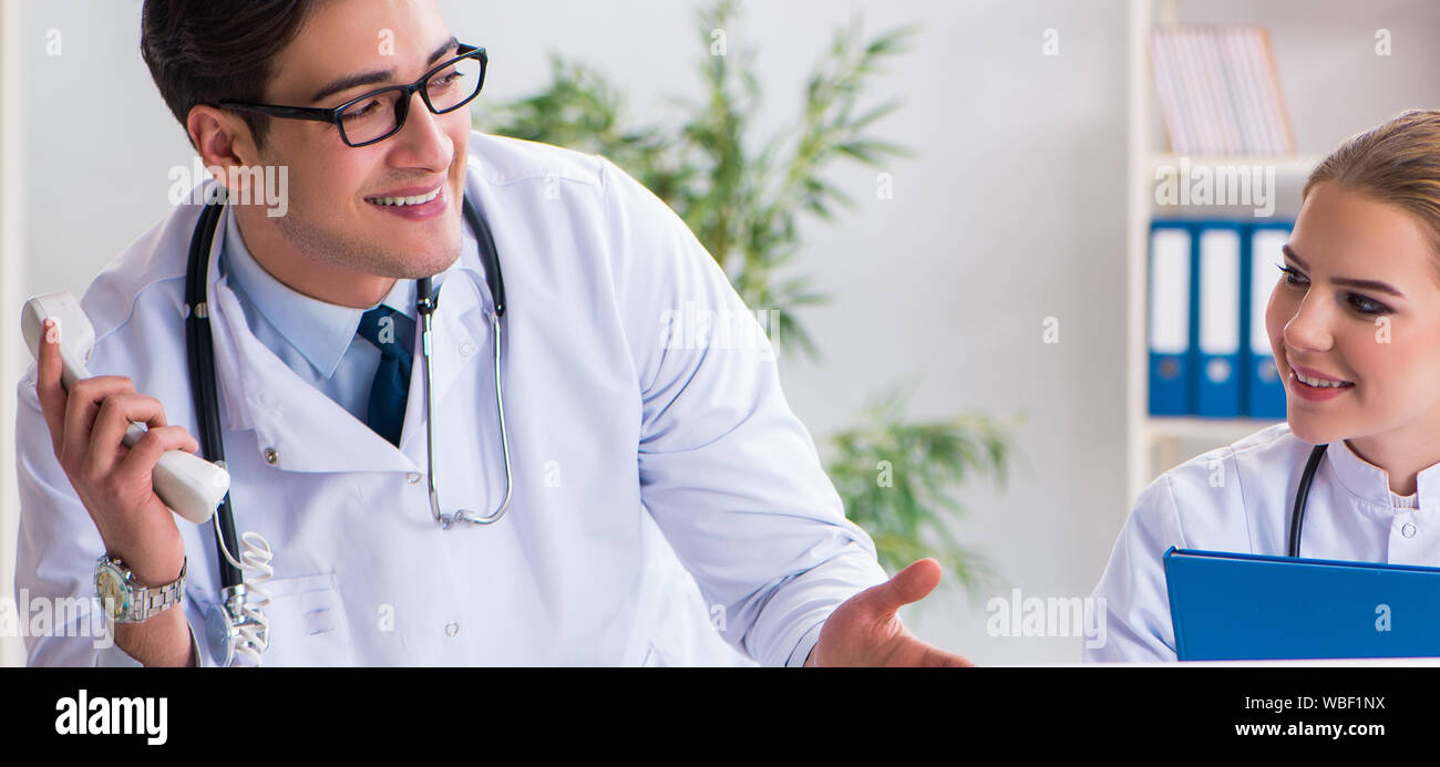 The male and female doctor having discussion in hospital Stock Photo ...