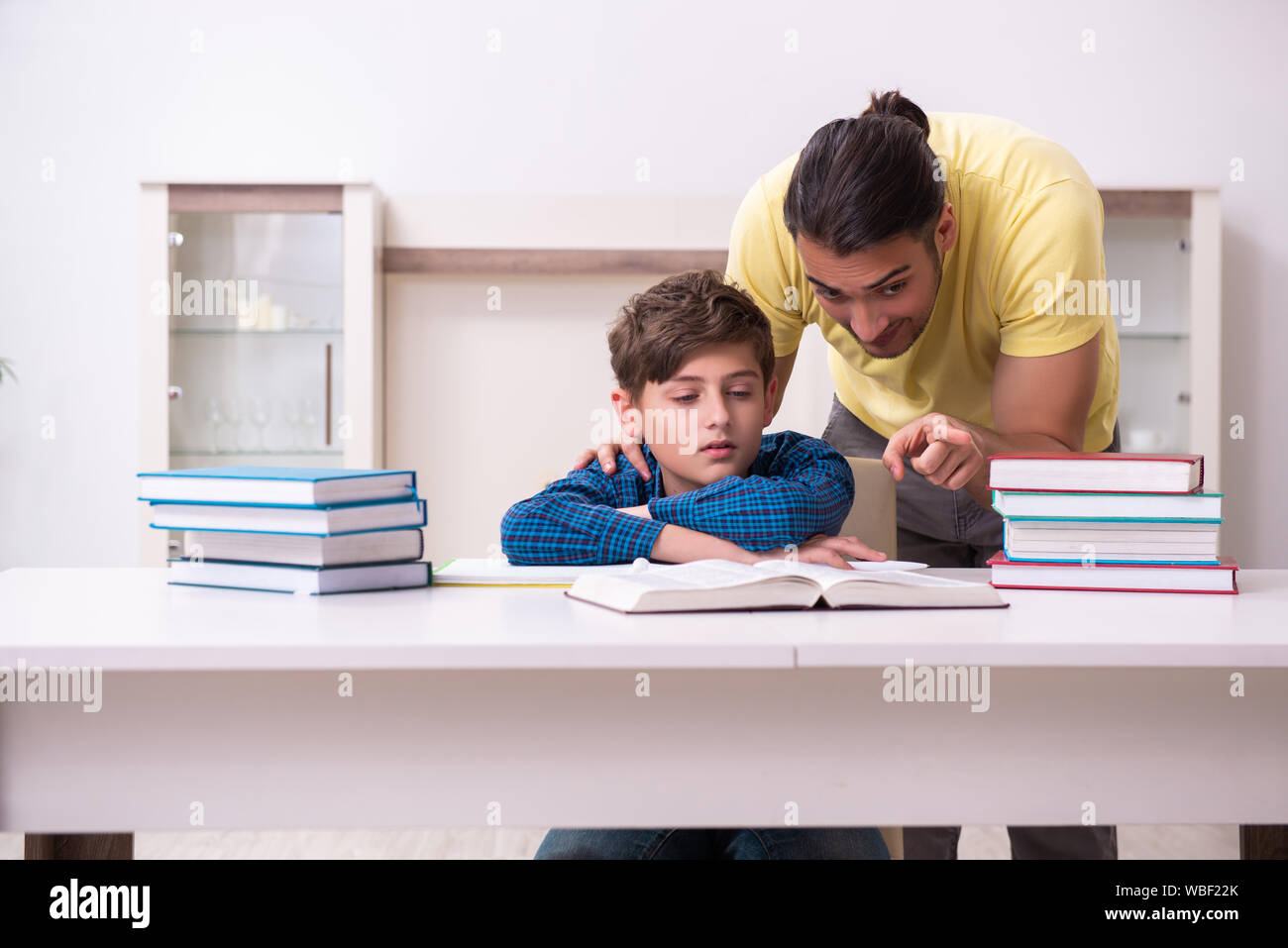 The father helping his son to prepare for school Stock Photo - Alamy