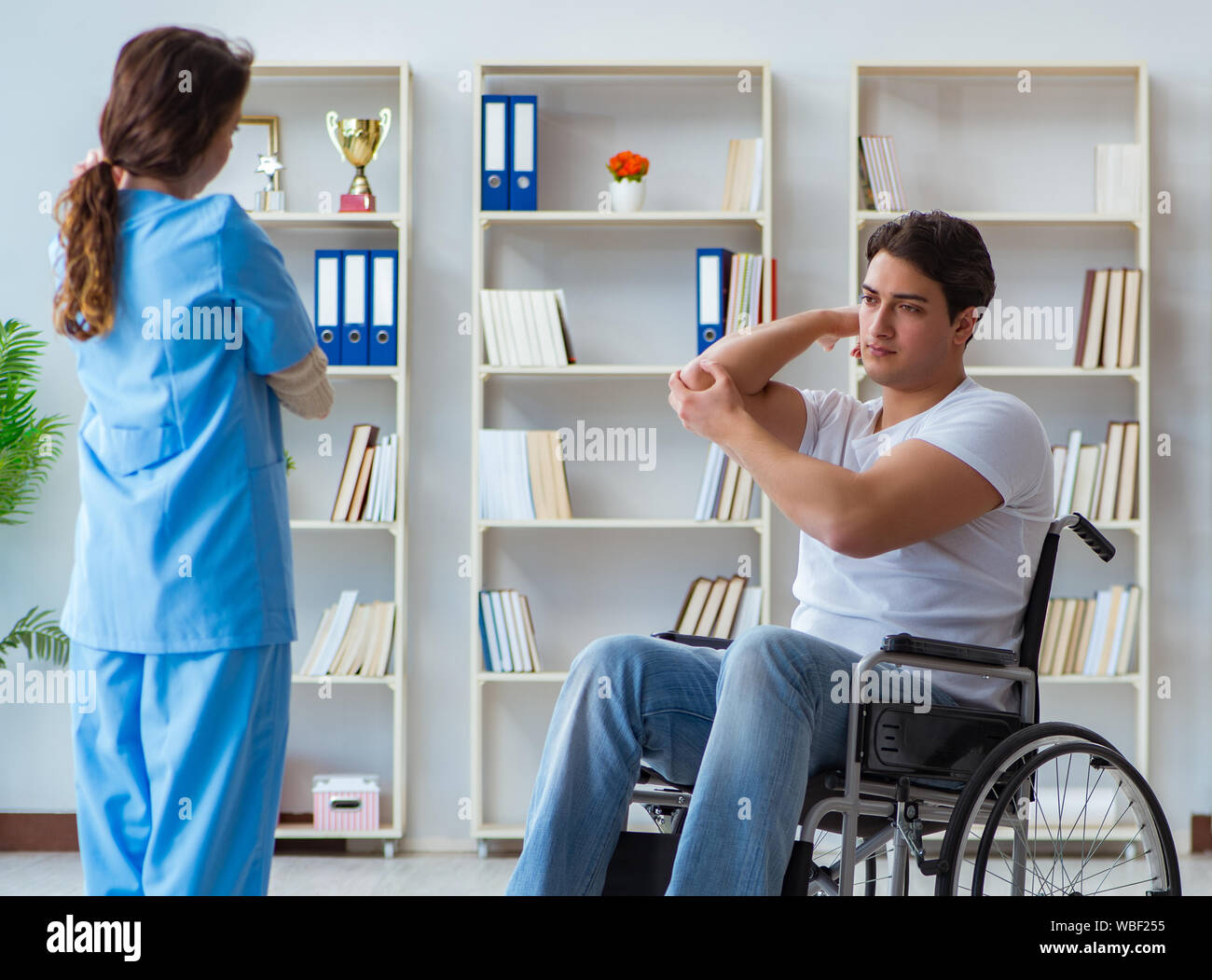 The patient undergoing rehabilitation recovery programme with doctor ...