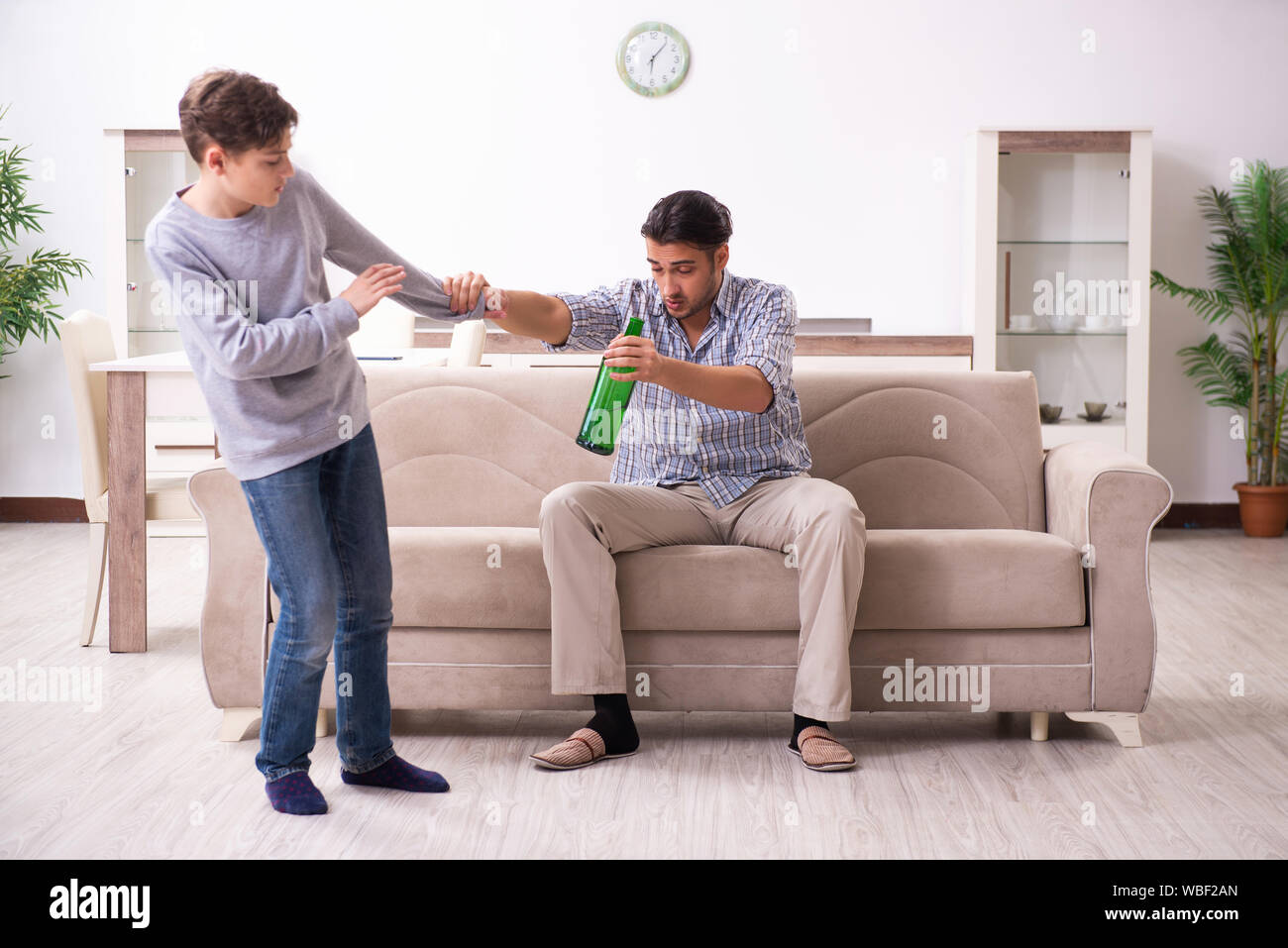 The drunk father and his son Stock Photo Alamy