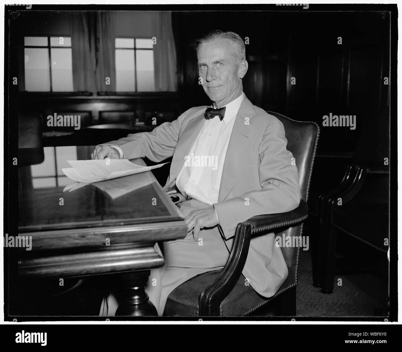 General Counsel of Civil Aeronautics Authority. Washington, D.C., Aug. 22. Charles Guthrie, recently named General Counsel of the new Civil Aeronautics Authority, photographed at his desk today shortly after taking the oath of office Abstract/medium: 1 negative : glass ; 4 x 5 in. or smaller Stock Photo