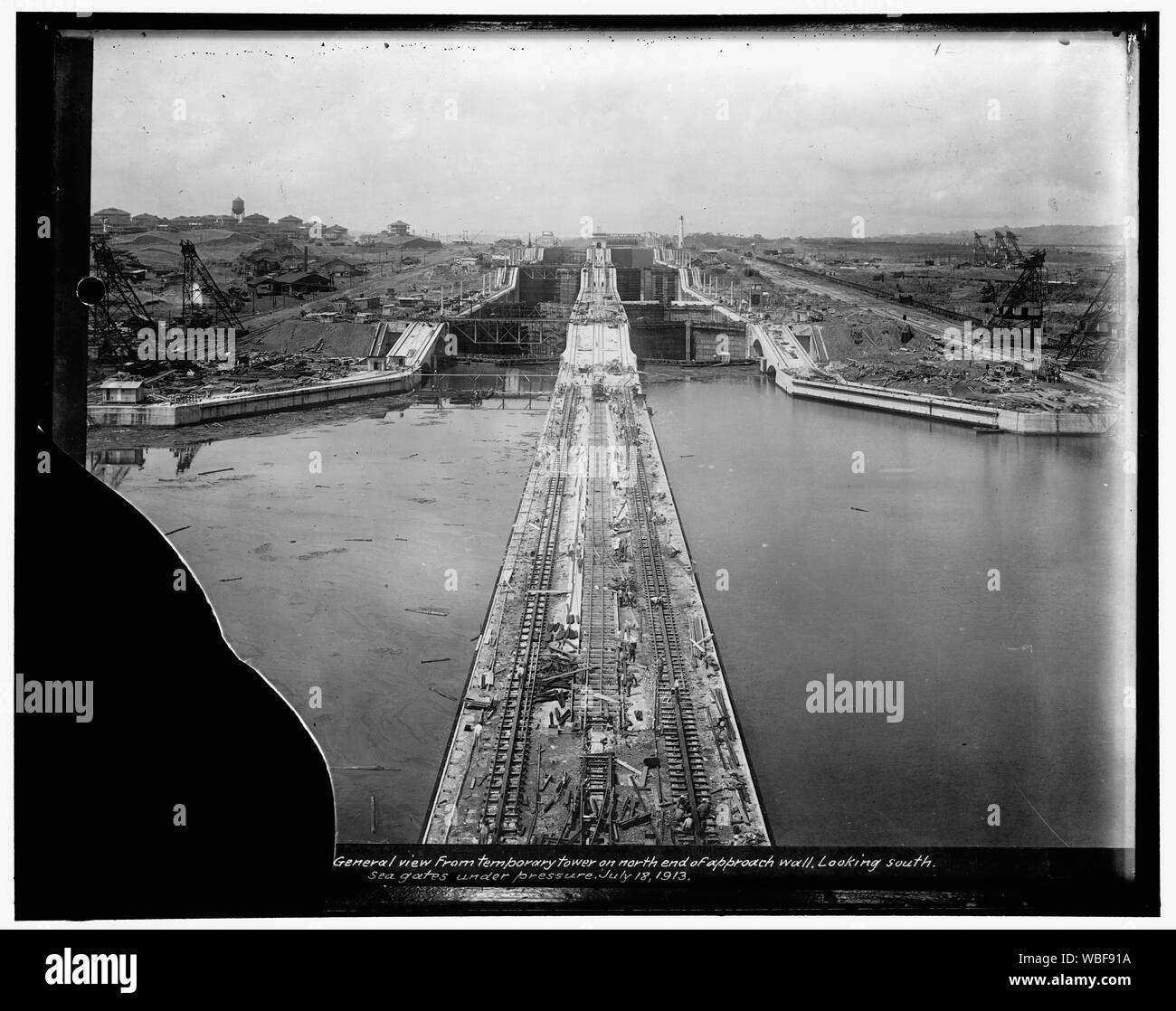 General view from temporary tower on north end of approach wall. Looking south. Sea gates under pressure, July 18, 1913 Abstract/medium: 1 negative : glass ; 8 x 10 in. or smaller Stock Photo