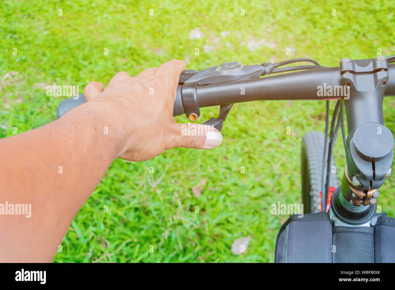 hand cyclist hold handle bike Stock Photo - Alamy