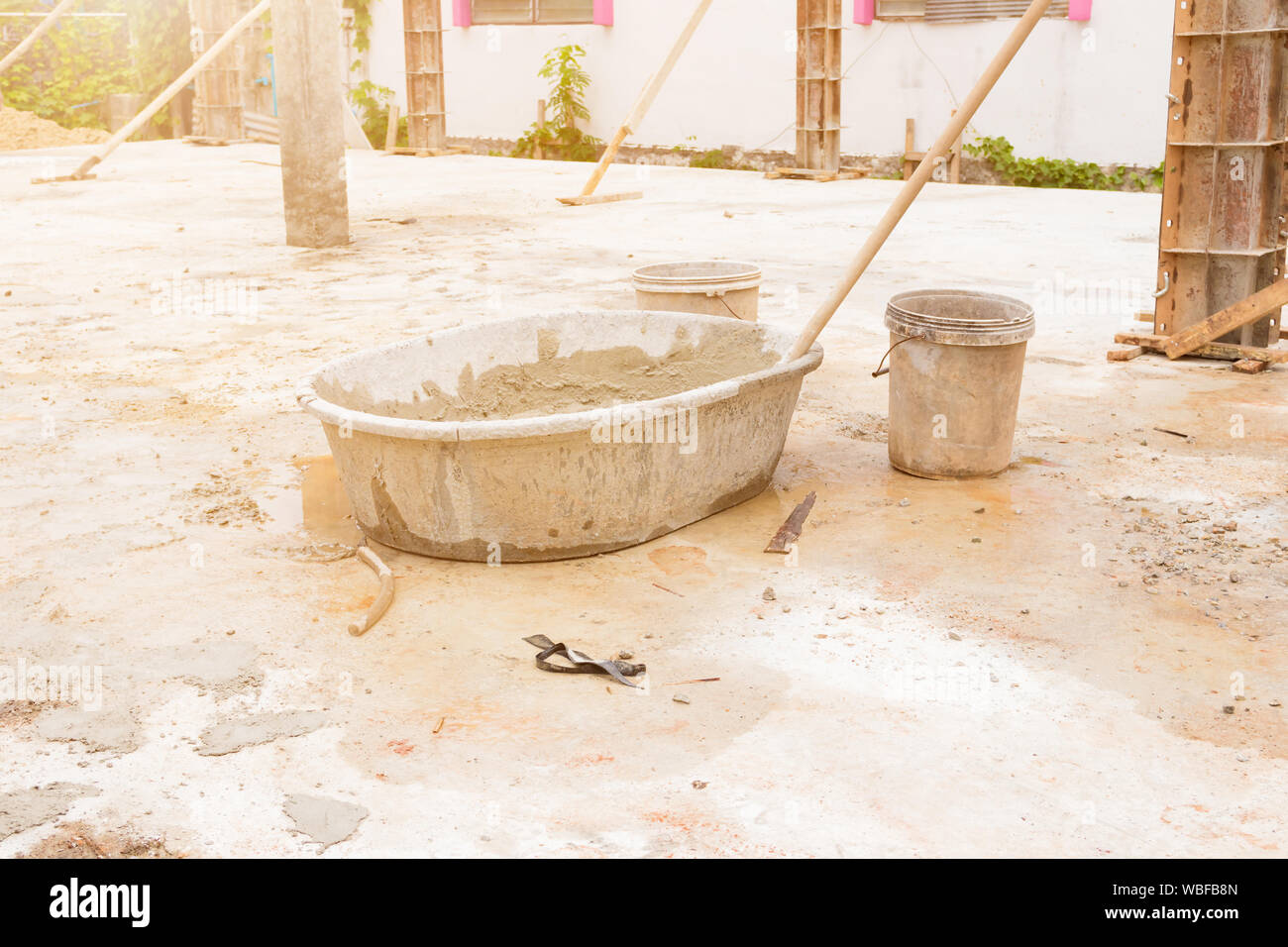 mortar in black plastic bucket cement mixer in workplace construction with copy space add text