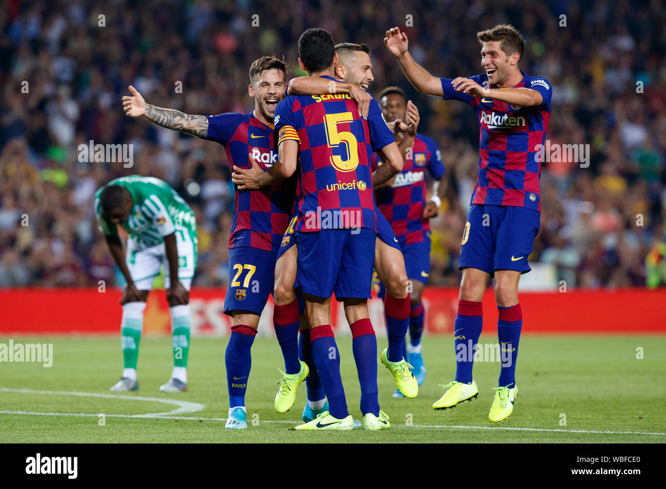 Barcelona, Spain. 25th Aug, 2019. BARCELONA, SPAIN - AUGUST 25: Jordi Alba of FC Barcelona celebrates with Sergio Busquets, Carles Perez and Sergi Roberto after scoring his team's fourth goal during the Liga match between FC Barcelona and Real Betis at Camp Nou on August 25, 2019 in Barcelona, Spain. (Photo by David Ramirez/Pacific Press) Credit: Pacific Press Agency/Alamy Live News Stock Photo