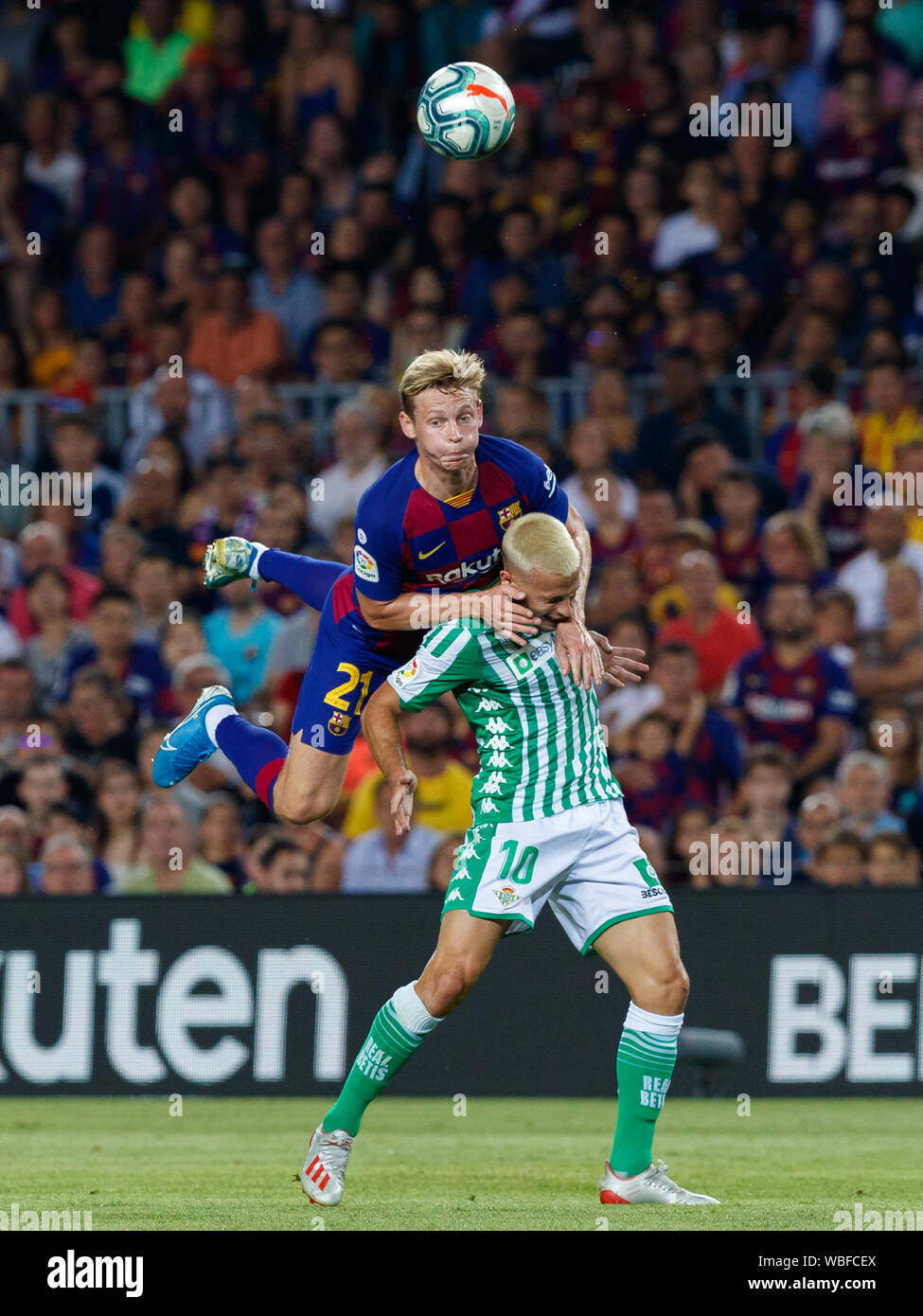 Barcelona, Spain. 25th Aug, 2019. BARCELONA, SPAIN - AUGUST 25: Sergio Canales of Real Betis in action with Frenkie de Jong of FC Barcelona during the Liga match between FC Barcelona and Real Betis at Camp Nou on August 25, 2019 in Barcelona, Spain. (Photo by David Ramirez/Pacific Press) Credit: Pacific Press Agency/Alamy Live News Stock Photo
