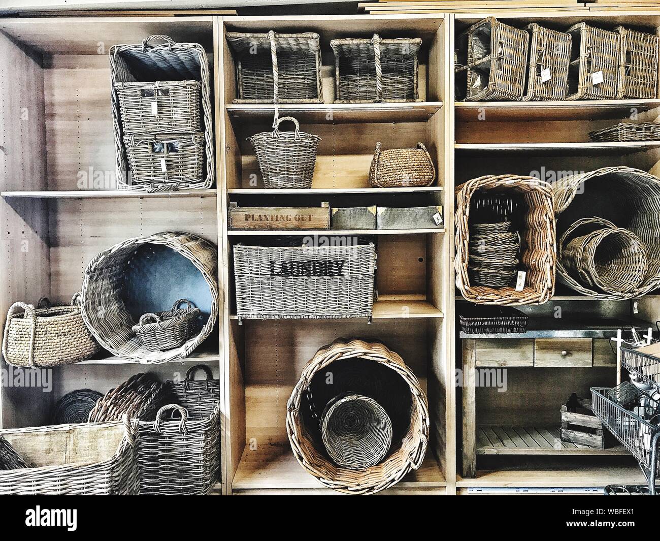 Wicker baskets on shelves hires stock photography and images Alamy