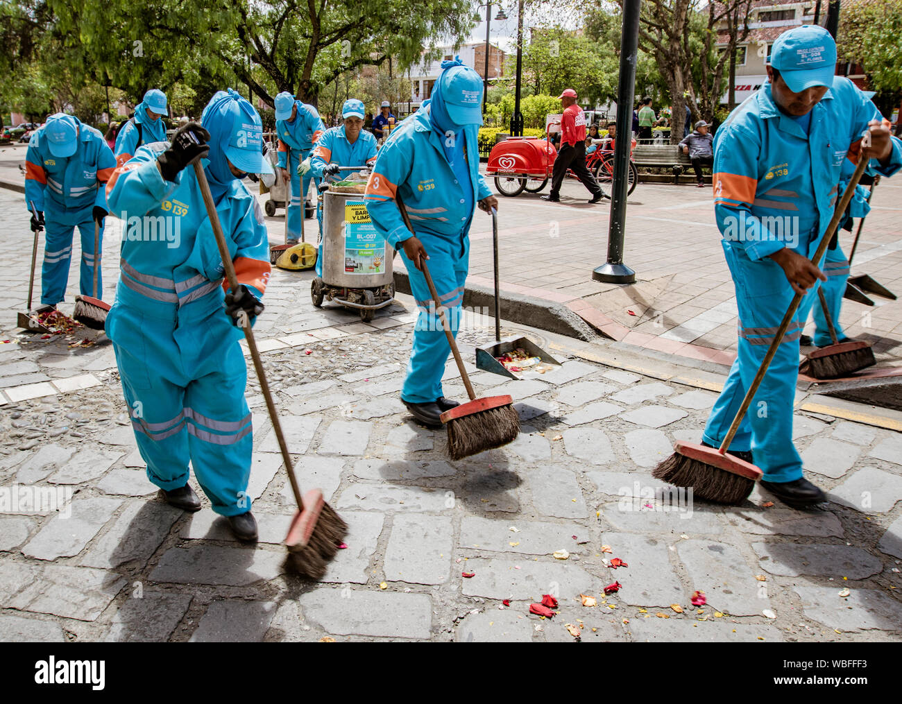 Cuenca, Ecuador, Jan 13, 2018: Crew cleans up after parade in Cuenca, Ecuador Stock Photo