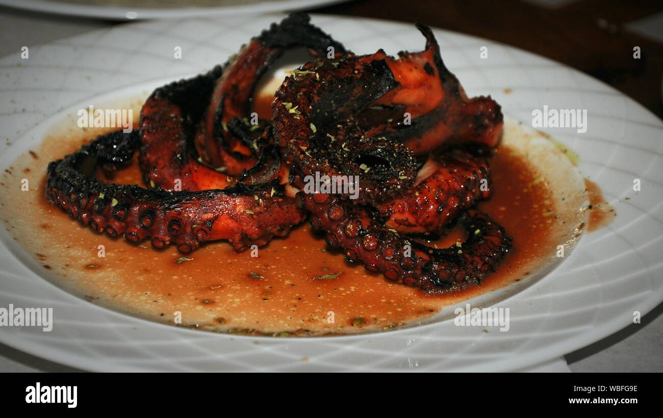 Close-up Of Grilled Octopus Served In Plate Stock Photo