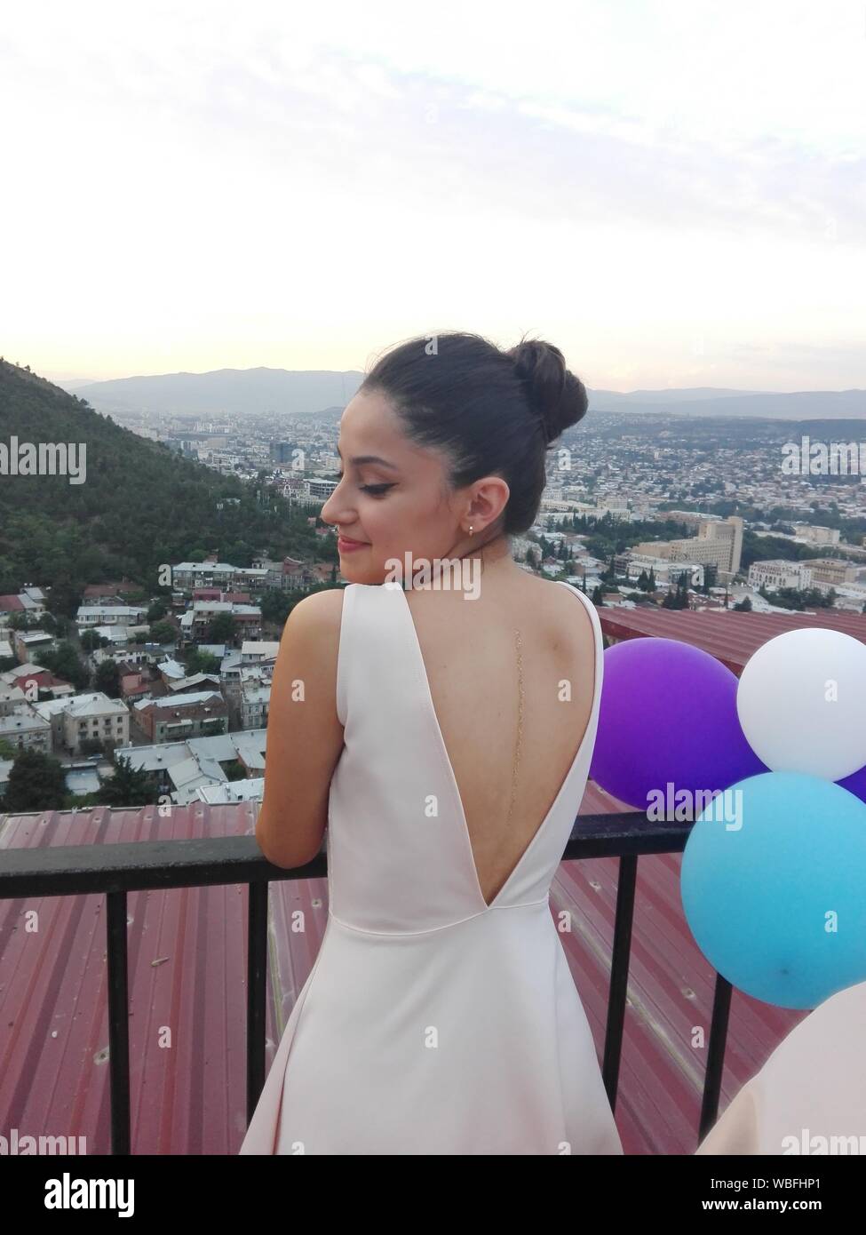 Woman standing rear view dress hi-res stock photography and images - Alamy