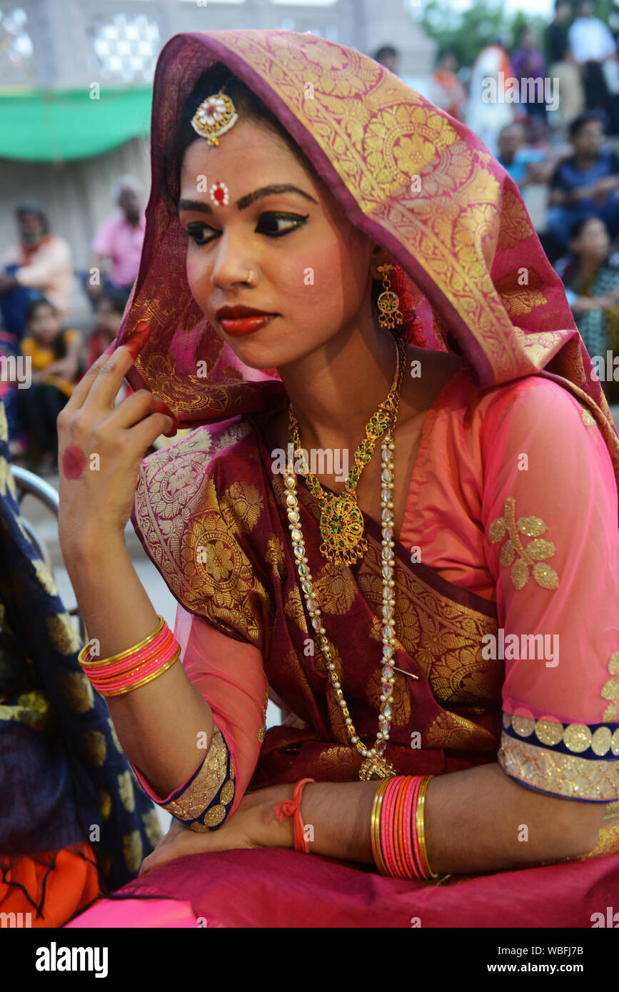 Indian dancers wearing traditional sari with the Seedha pallu drape . Stock Photo