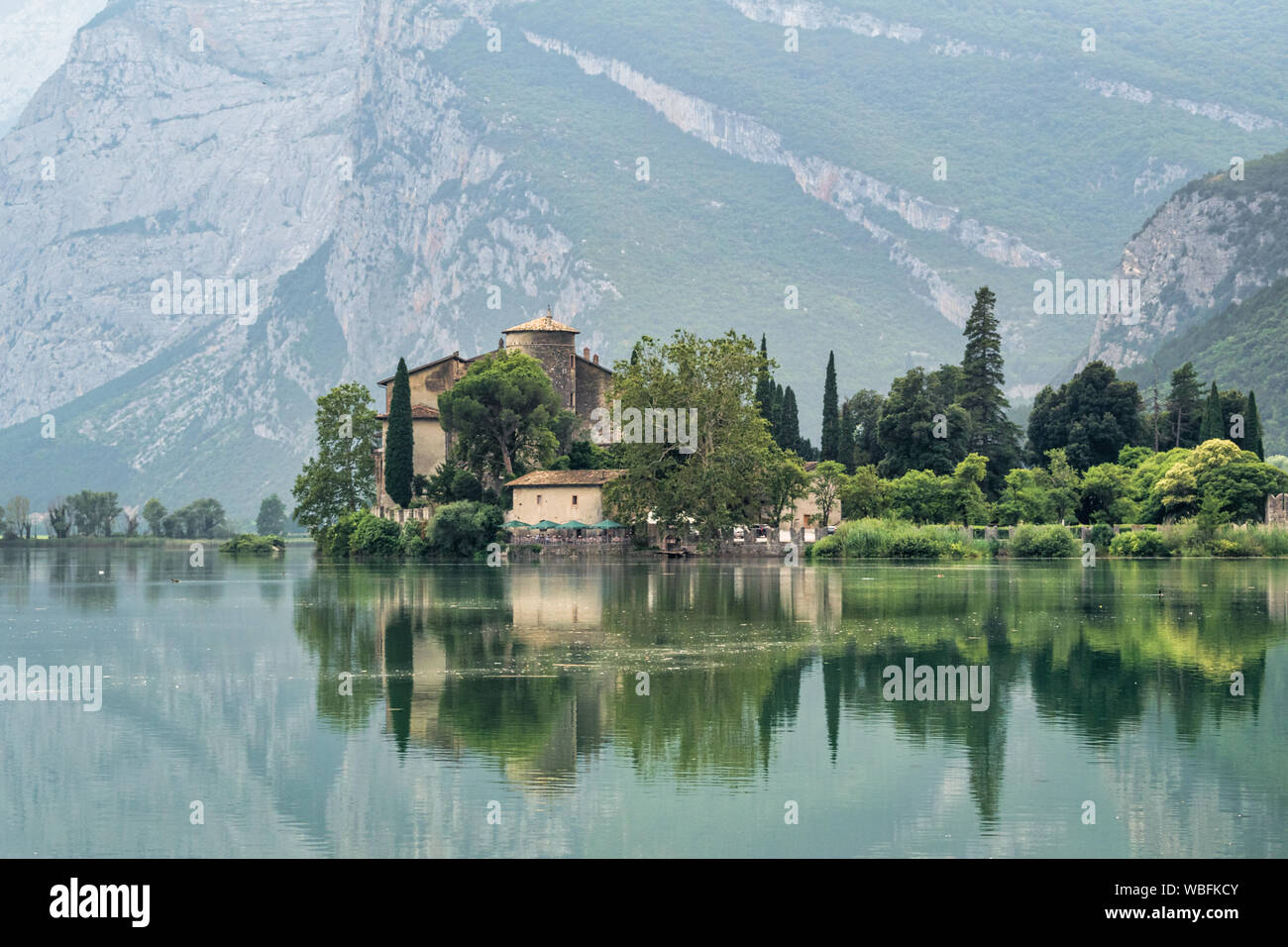 Castle Toblino, Italy - July 25, 2019 : The reflections of Tobilino Castle in the Trento Region of Italy Stock Photo