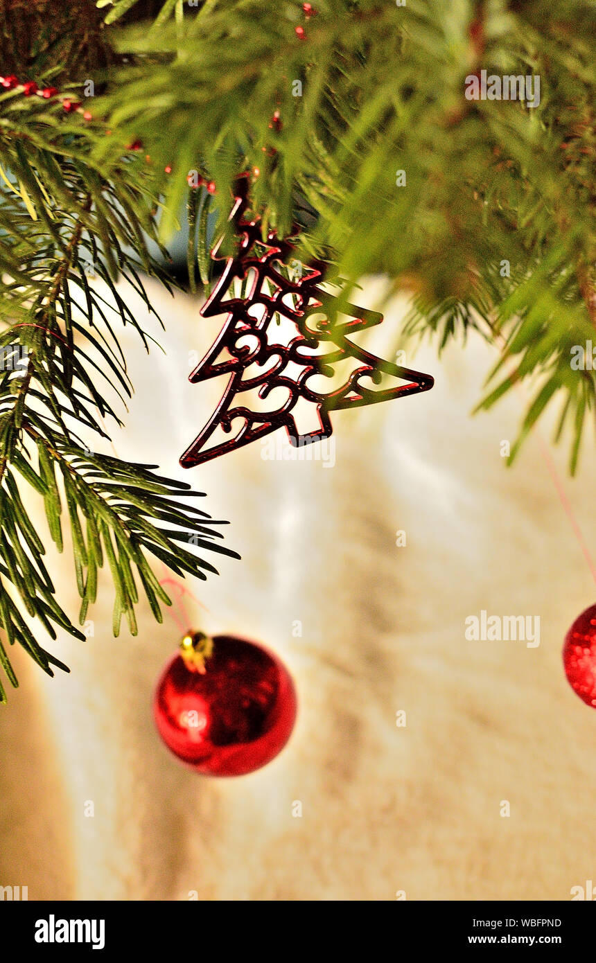 Red Ornaments on Christmas Tree. Stock Photo