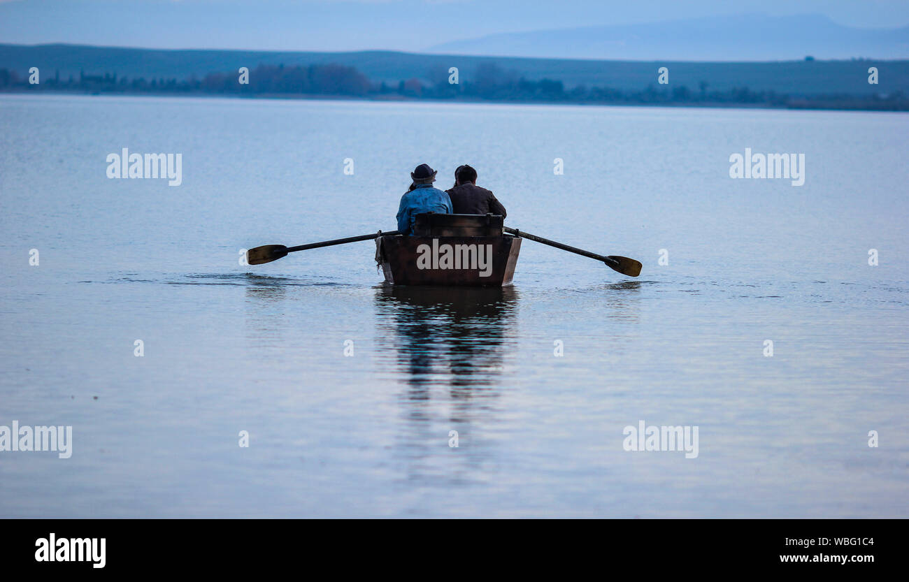 Rear View Of People Boating On Lake Stock Photo - Alamy