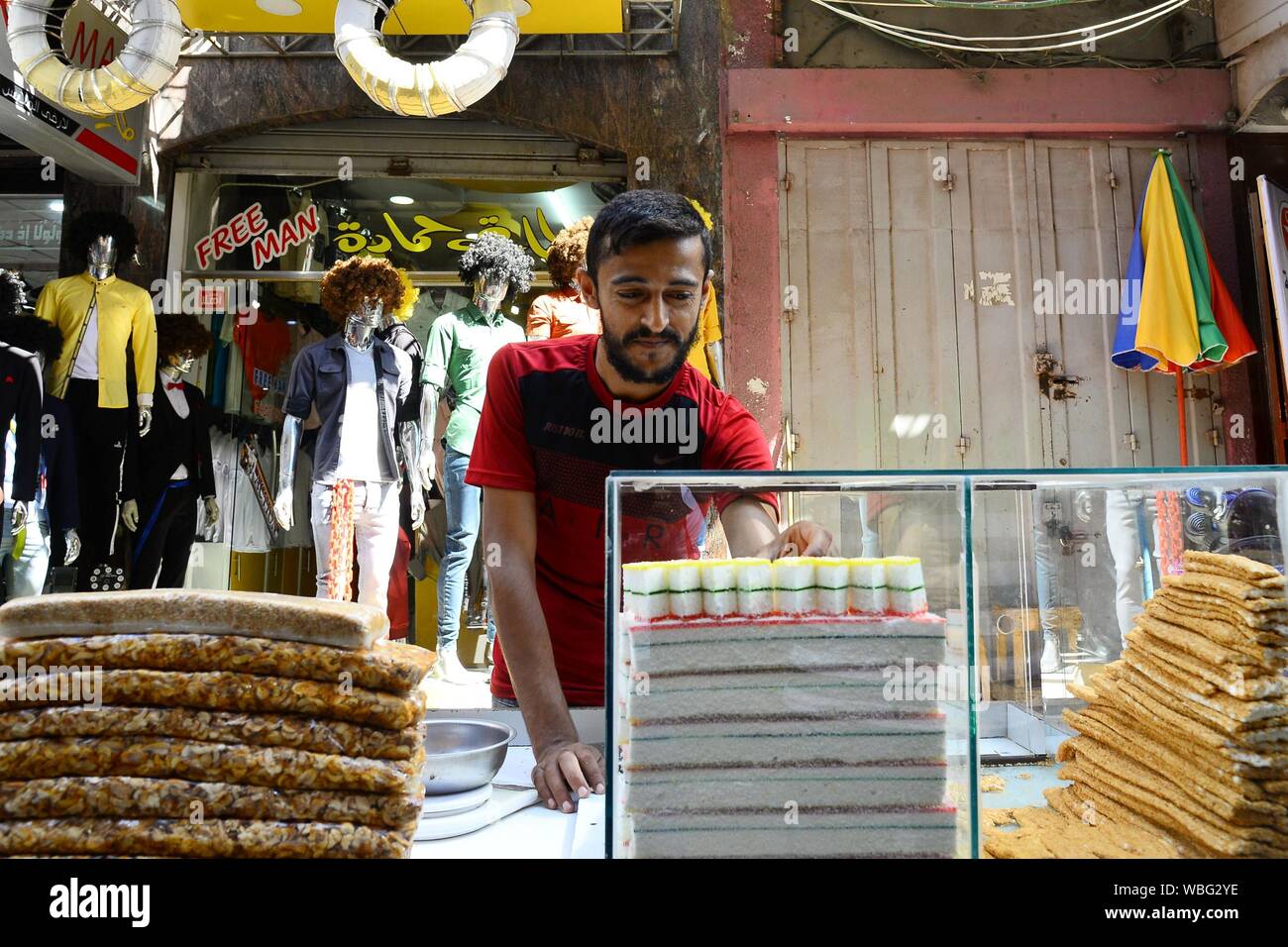 (190827) -- GAZA, Aug. 27, 2019 (Xinhua) -- A vendor sells sweets in Gaza City, Aug. 26, 2019. (Str/Xinhua) Stock Photo