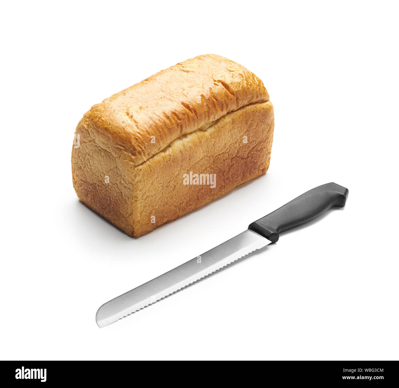 Bread and bread knife on white background Stock Photo