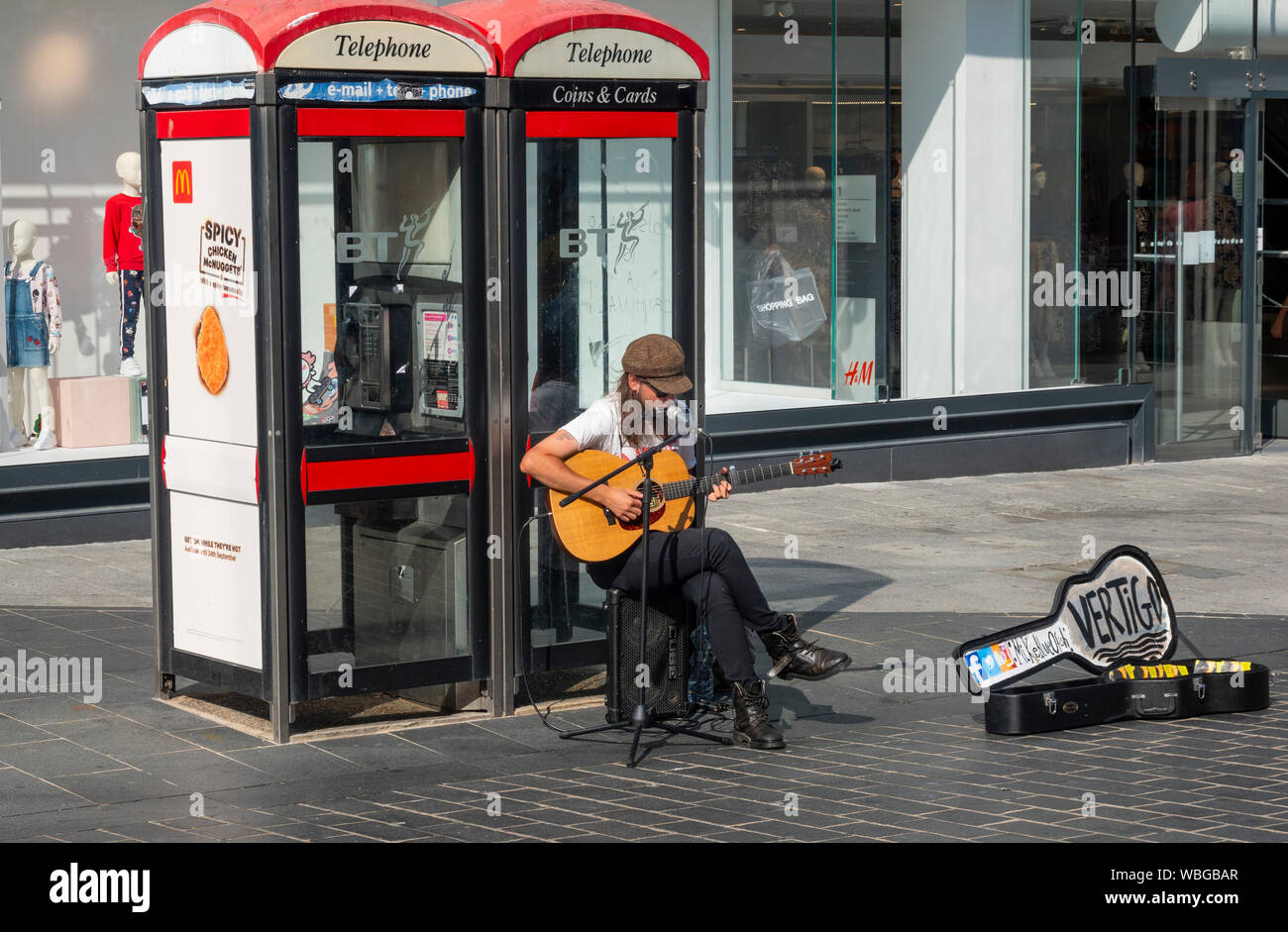 Busker on a street in Liverpool Stock Photo