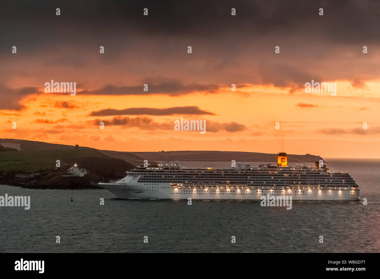 Cork Harbour, Ireland. 27th Aug, 2019. Cruise liner Costa Mediterranea about to pass the Roches Point Lighthouse as she enters Cork Harbour before dawn with 2680 passengers who will spend the day in Cobh, Co. Cork, Ireland. Credit; Credit: David Creedon/Alamy Live News Stock Photo
